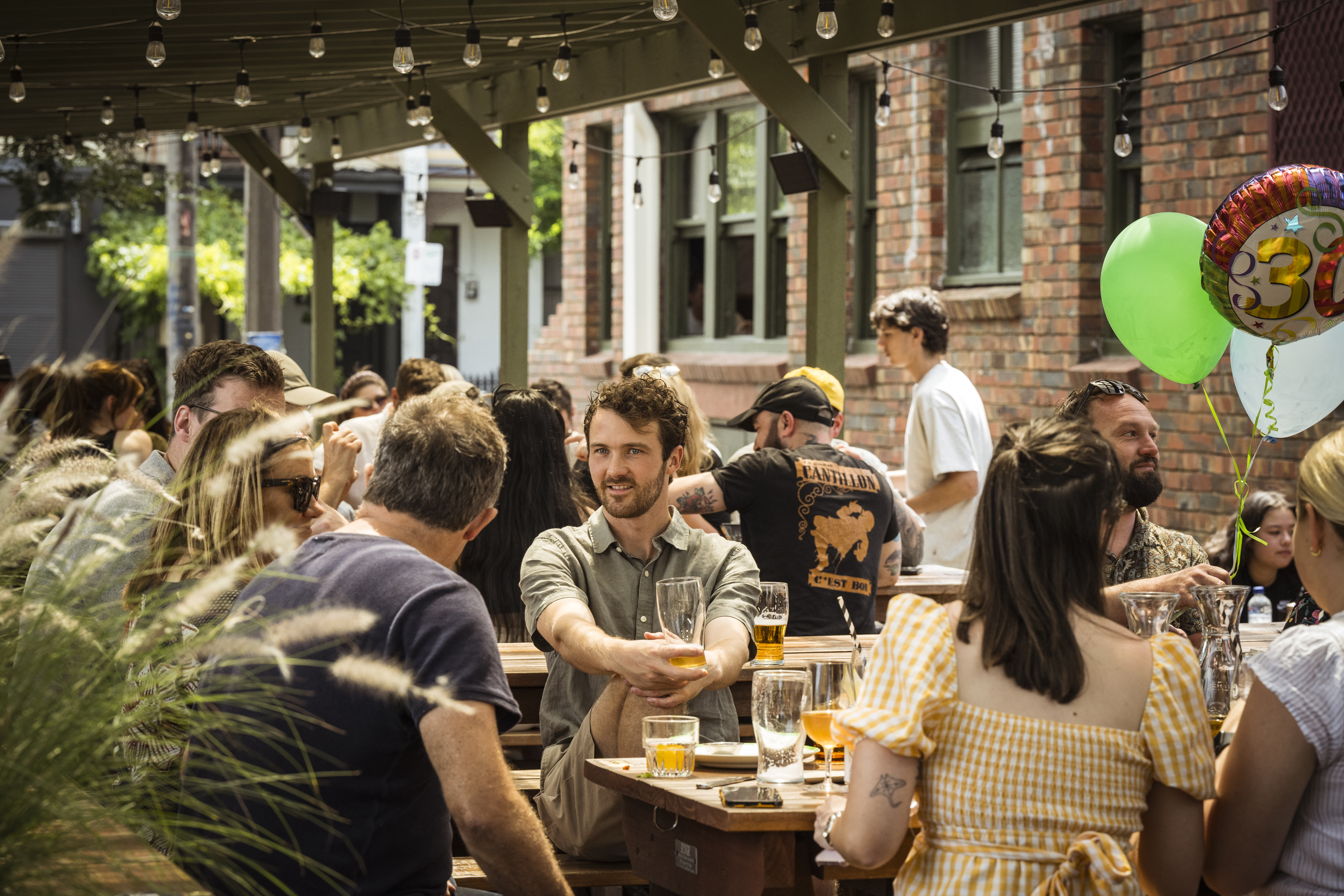 People drinking in a beer garden.