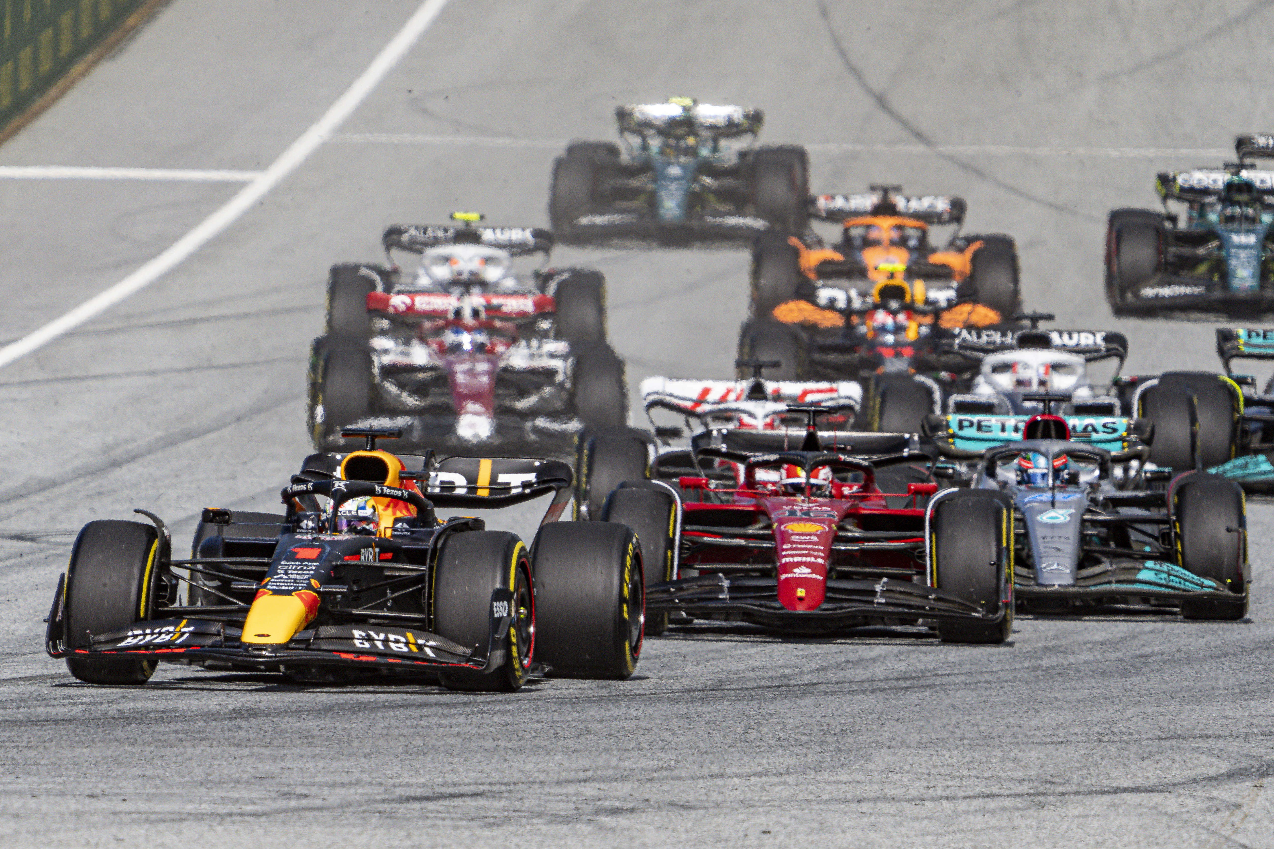 Red Bull's Max Verstappen leads Ferrari's Charles Leclerc and Mercedes' George Russell during the Austrian F1 Sprint.