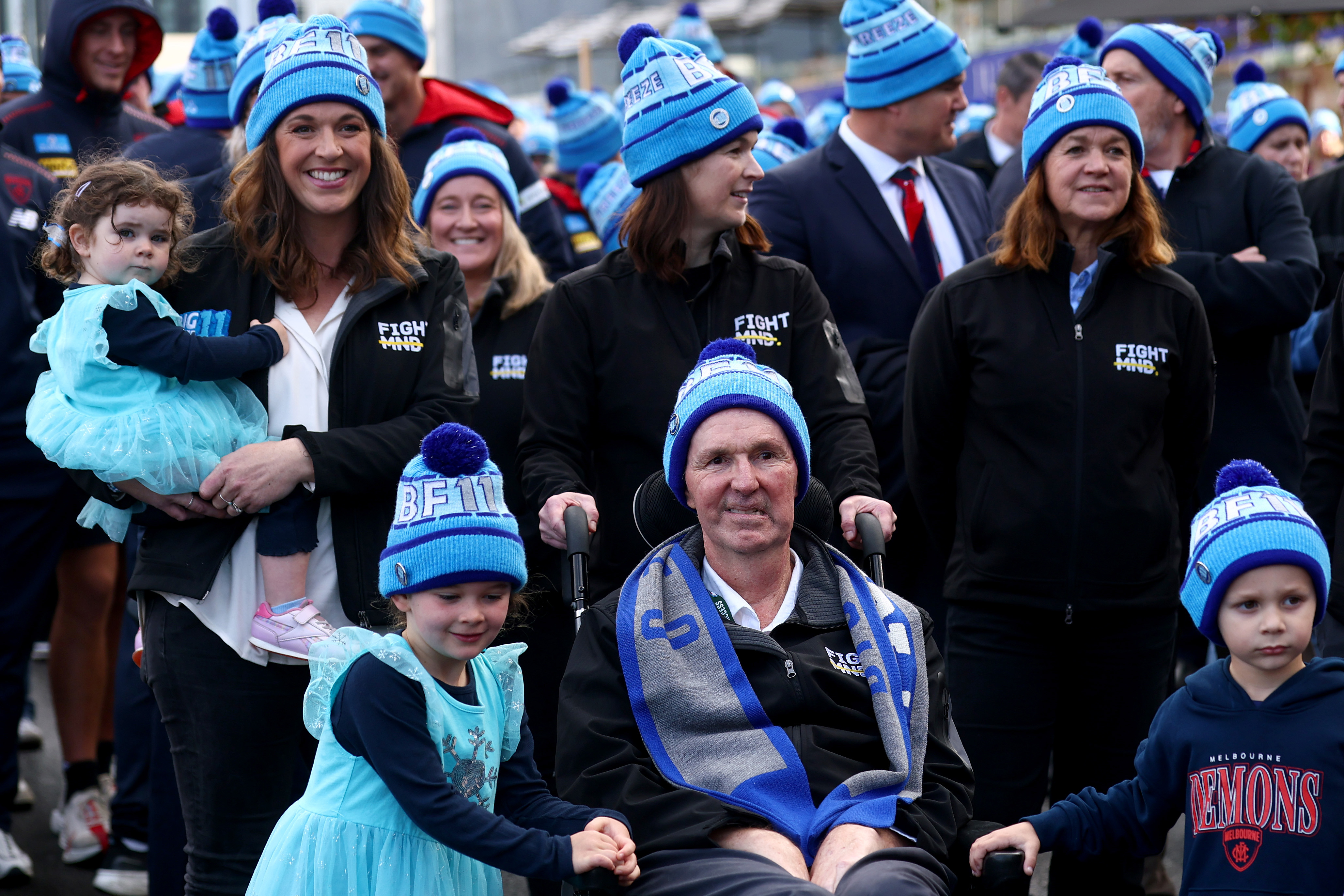 MELBOURNE, AUSTRALIA - JUNE 09: Bec Daniher, Neale Daniher and Jan Daniher lead the 'Walk To The 'G' at Melbourne Cricket Ground on June 09, 2025 in Melbourne, Australia. (Photo by Josh Chadwick/Getty Images)
