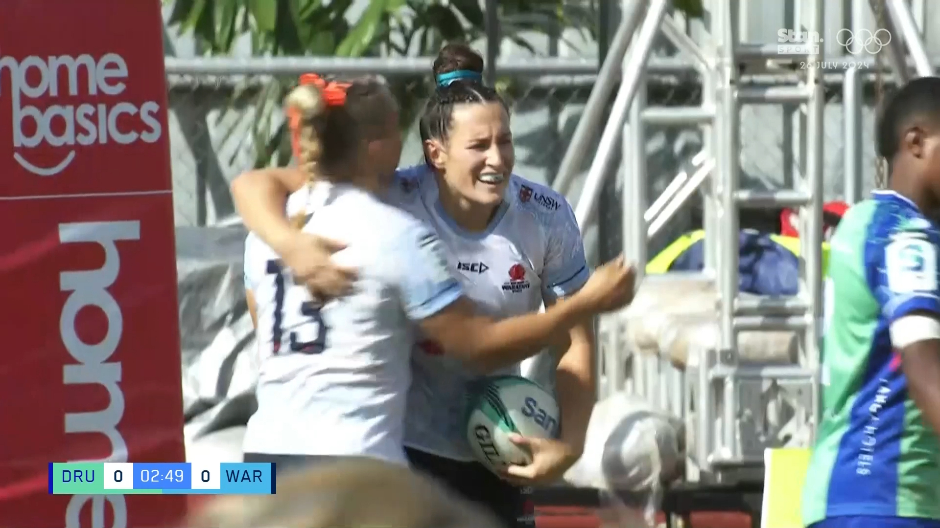 Maya Stewart celebrates scoring a try for the Waratahs.