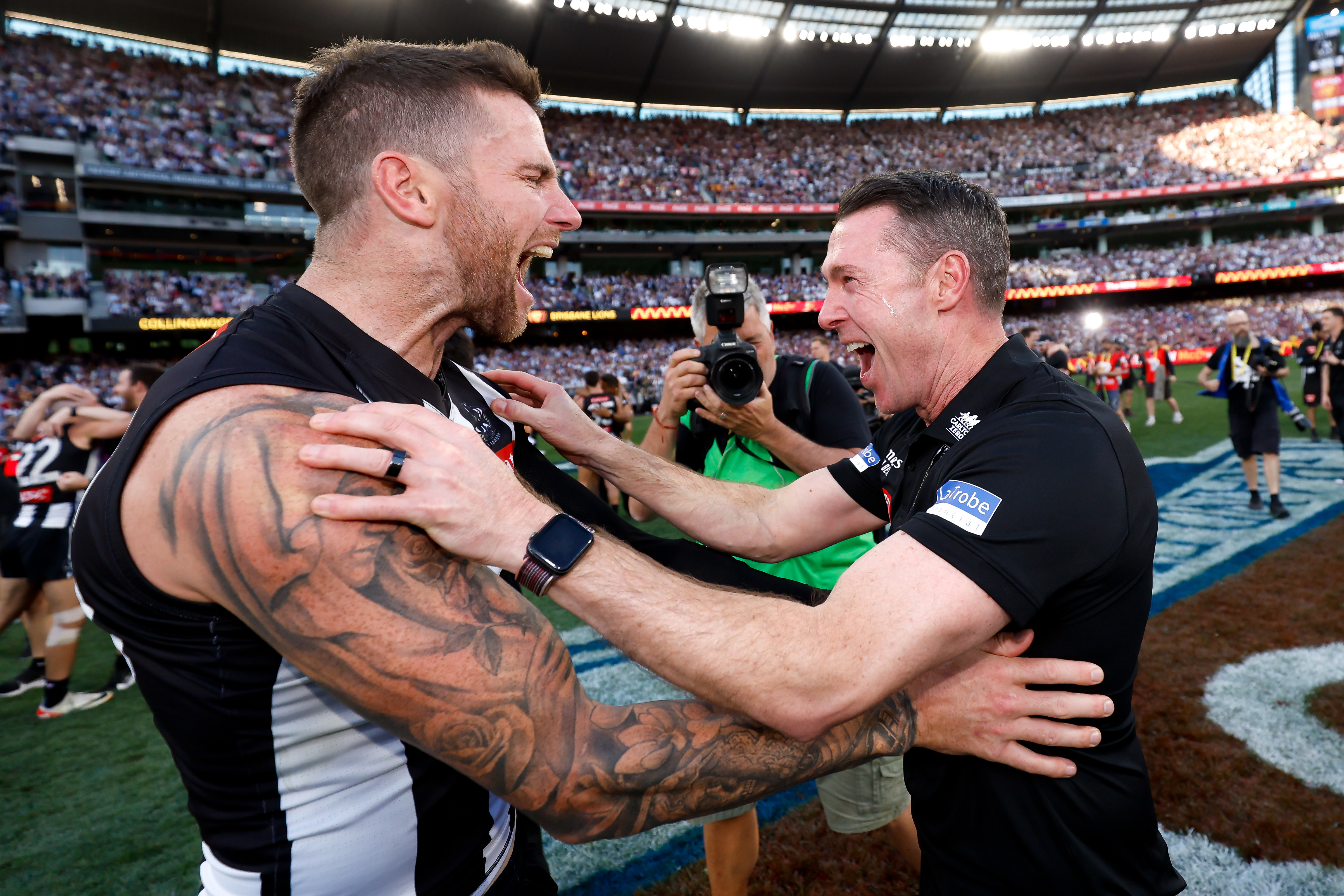 MELBOURNE, AUSTRALIA - SEPTEMBER 30: Jeremy Howe of the Magpies and Craig McRae, Senior Coach of the Magpies celebrate during the 2023 AFL Grand Final match between the Collingwood Magpies and the Brisbane Lions at the Melbourne Cricket Ground on September 30, 2023 in Melbourne, Australia. (Photo by Dylan Burns/AFL Photos via Getty Images)