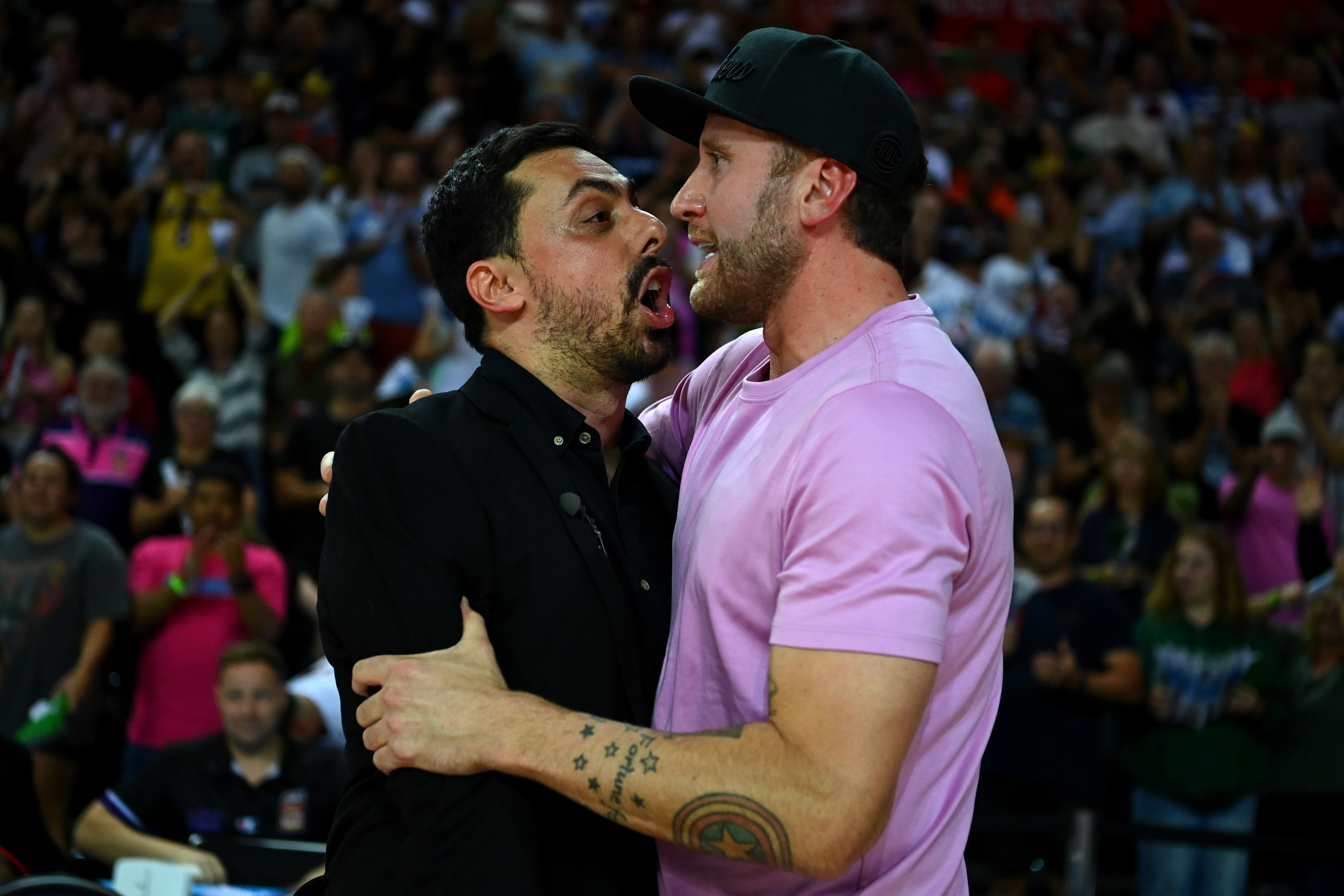 Breakers coach Mody Maor celebrates with team owner Matt Walsh.