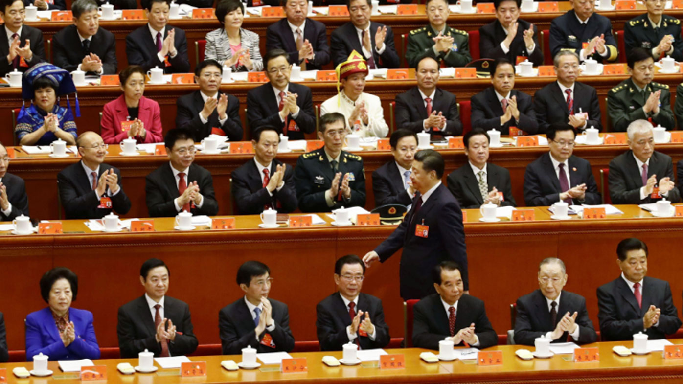 Chinese President Xi Jinping walks to deliver a speech at Beijing's Great Hall of the People. (AAP)