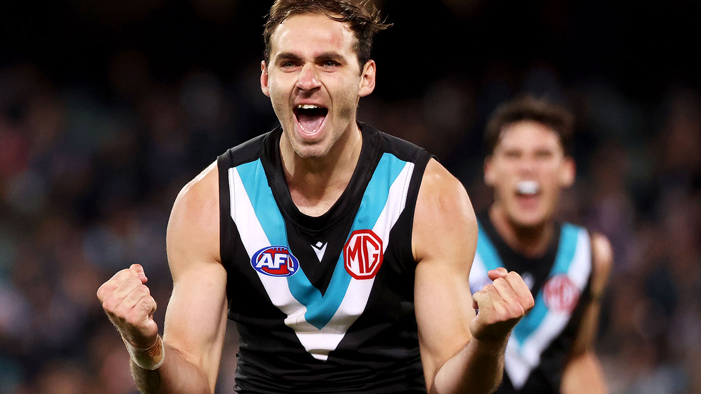 Jeremy Finlayson of the Power celebrates after kicking a goal