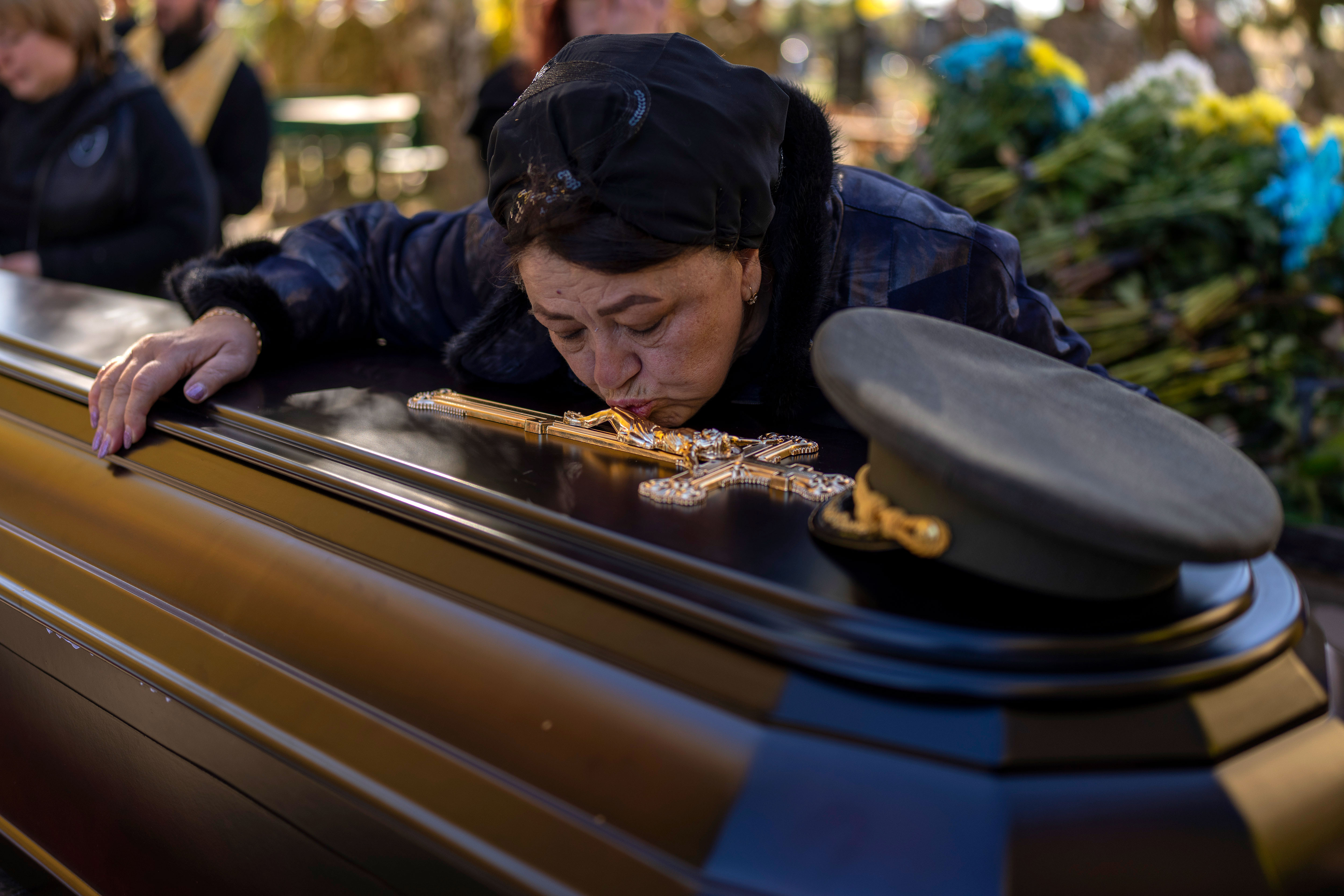 Tatiana Alexeyevna mourns over the coffin of her son Colonel Oleksiy Telizhenko.