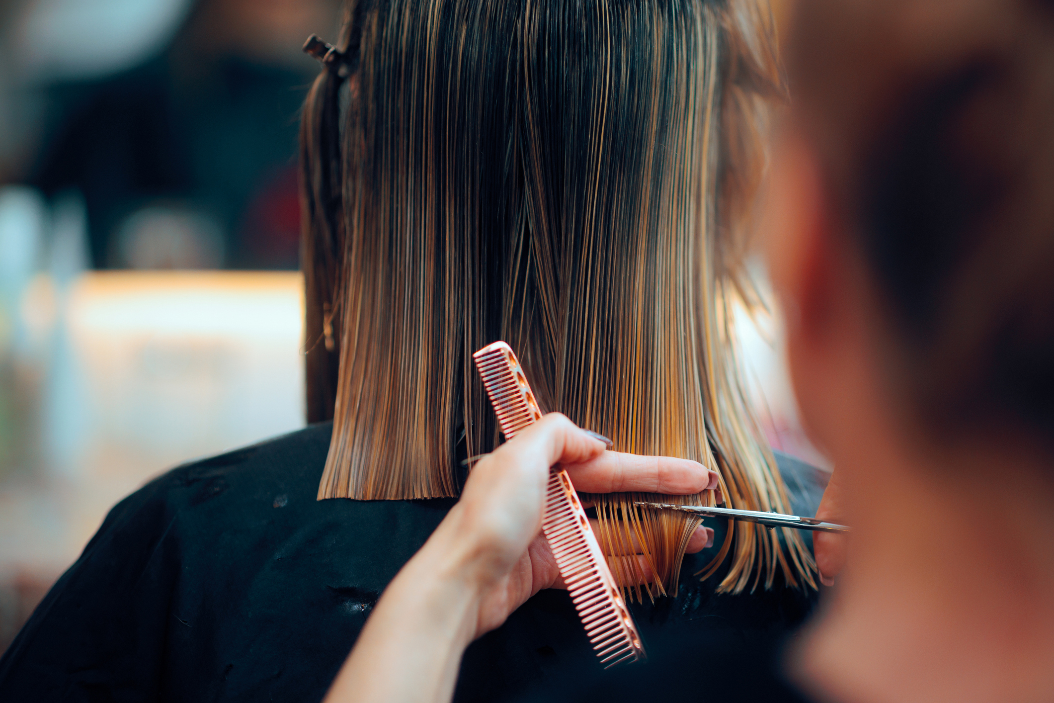 Professional beauty salon worker executing perfect ends trimming