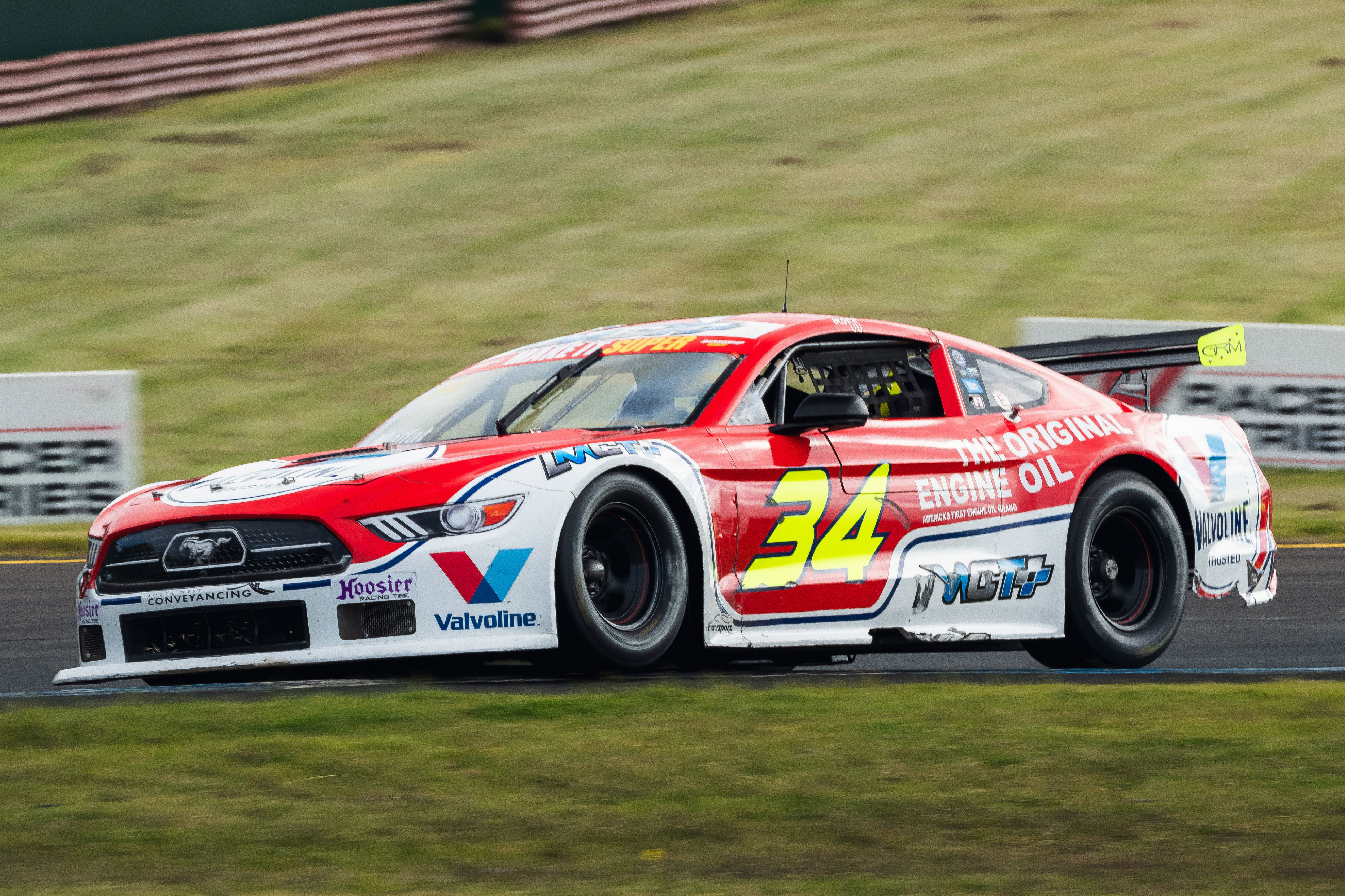 James Moffat climbs the kerb at turn three at Sandown.