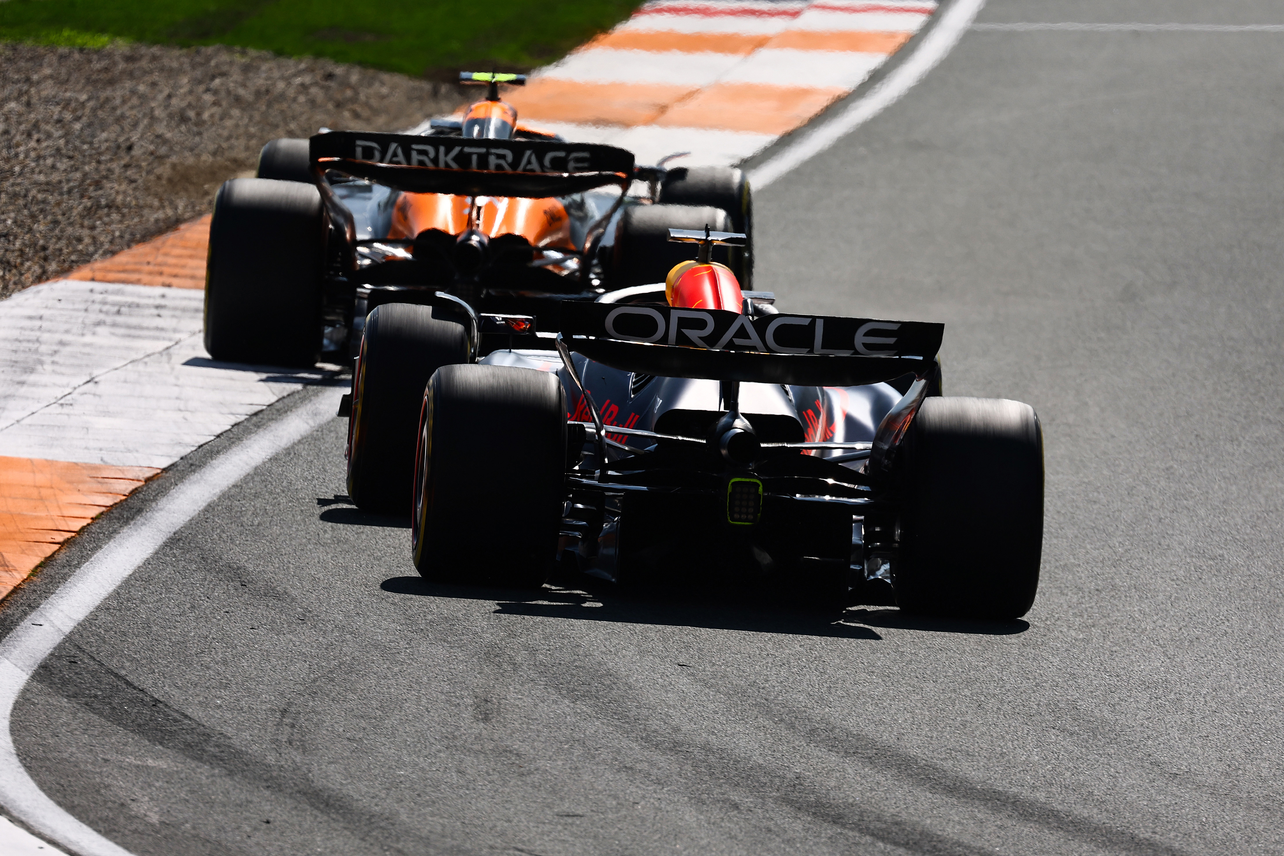 Max Verstappen of the Netherlands driving the (1) Oracle Red Bull Racing RB20 follows Lando Norris of Great Britain driving the (4) McLaren MCL38 Mercedes.