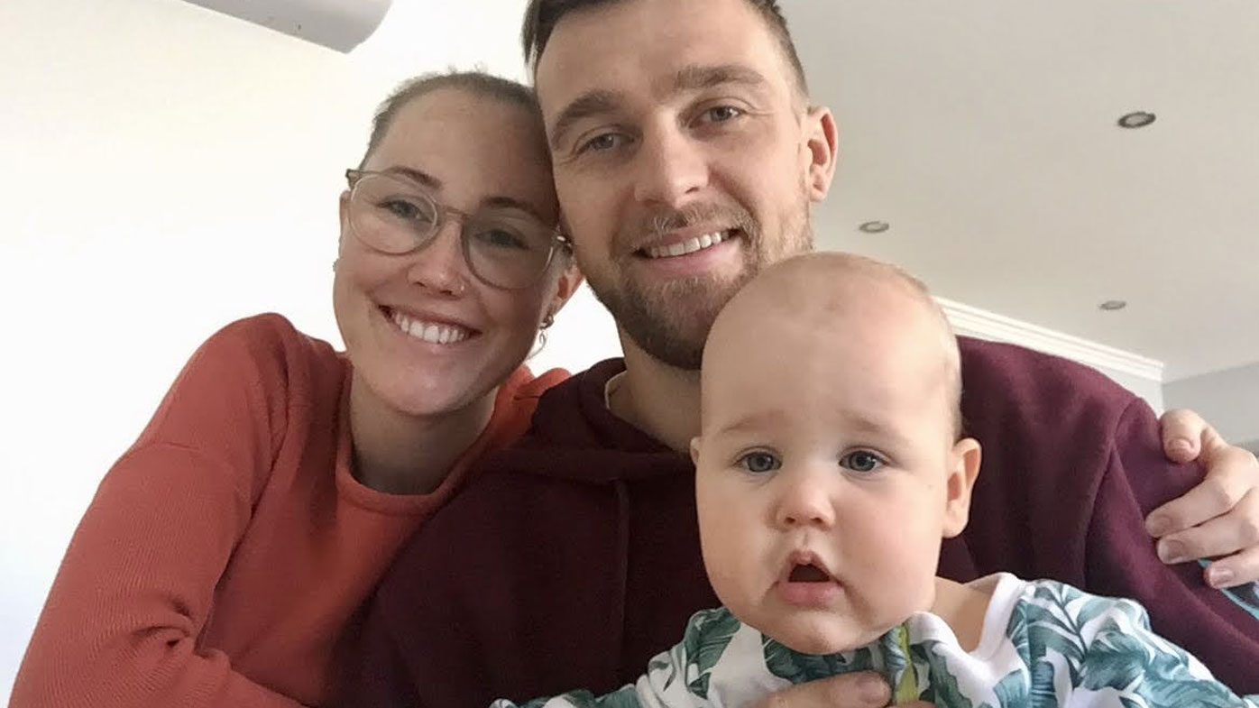Ella Hayes and Dale Fletcher with their son Marlow. The young family is also facing the prospect of Mr Fletcher having to travel overseas for his visa to be finalised.