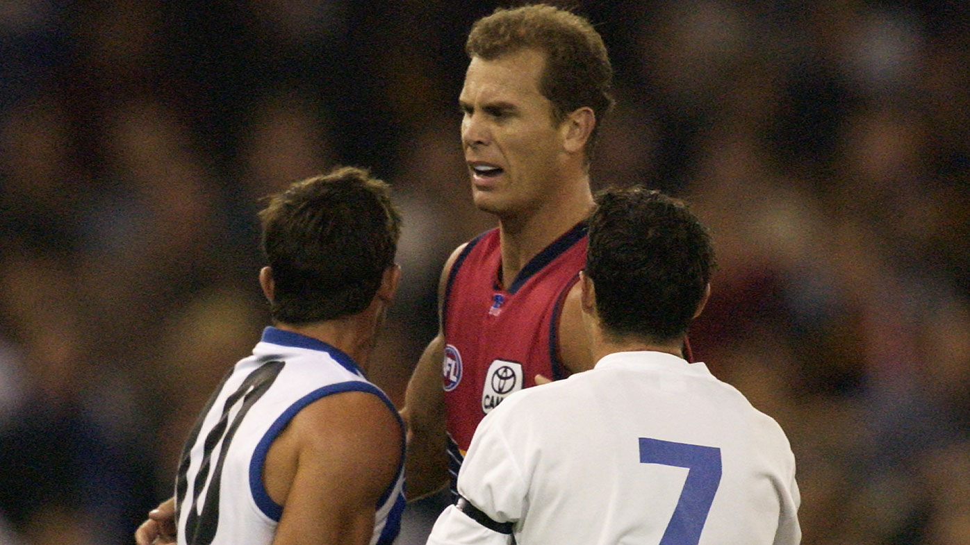 Wayne Carey and Anthony Stevens clash during a 2003 match-up