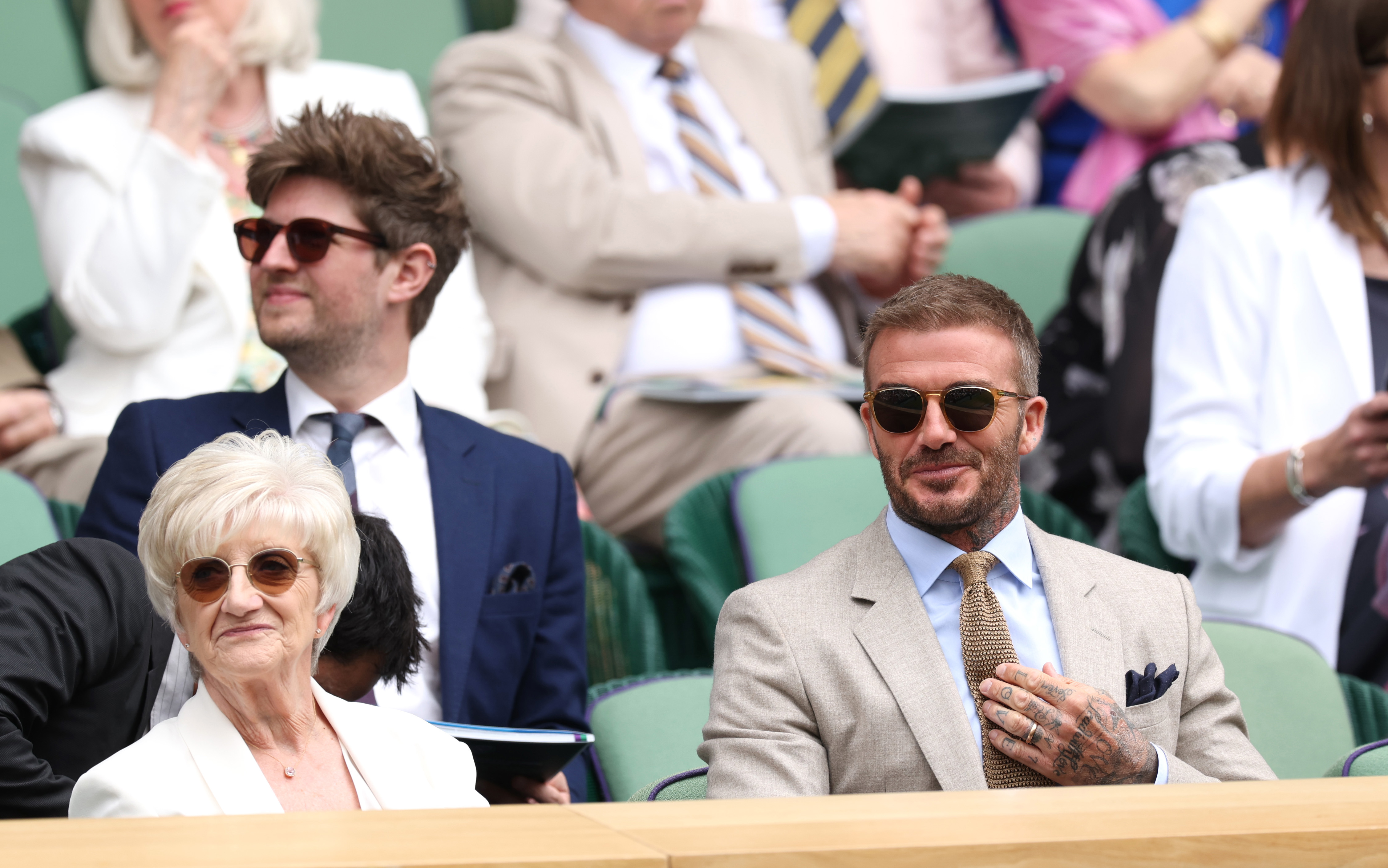 LONDON, ENGLAND - JULY 01: David Beckham and Mrs Sandra Beckham are seen in the Royal Box ahead of the Gentlemen's Singles first round match between Carlos Alcaraz of Spain and Dusan Lajovic of Serbia during day one of The Championships Wimbledon 2024 at All England Lawn Tennis and Croquet Club on July 01, 2024 in London, England. (Photo by Clive Brunskill/Getty Images)