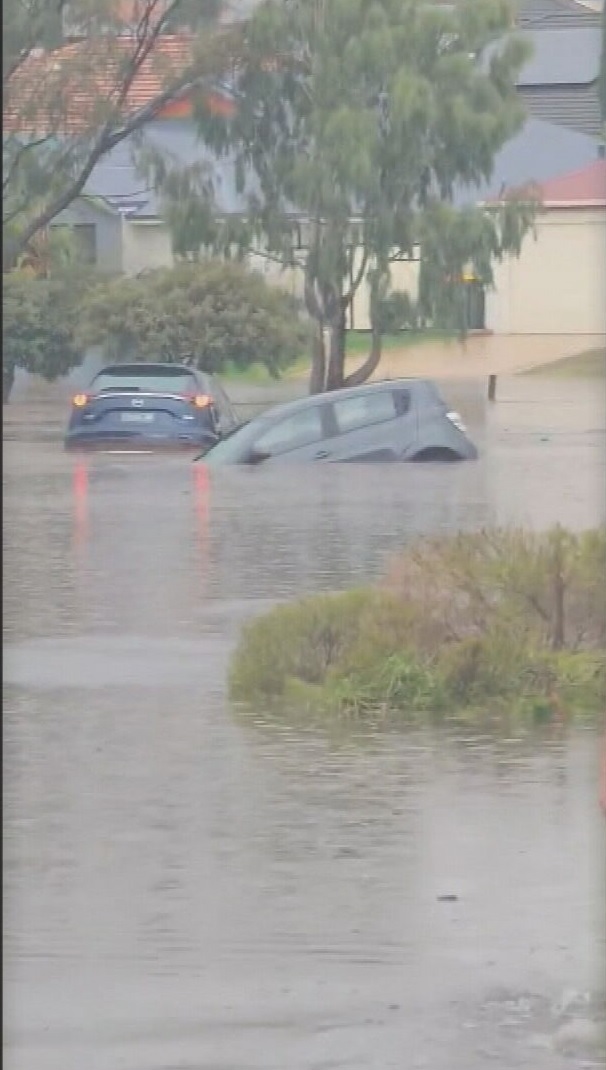 Perth's dry spell has ended in spectacular fashion after a major rain event smashed the city's northern suburbs with up to 100 millimetres falling in under an hour. Cars have ended up underwater after the extreme downpour caused flash flooding and trapped some drivers.