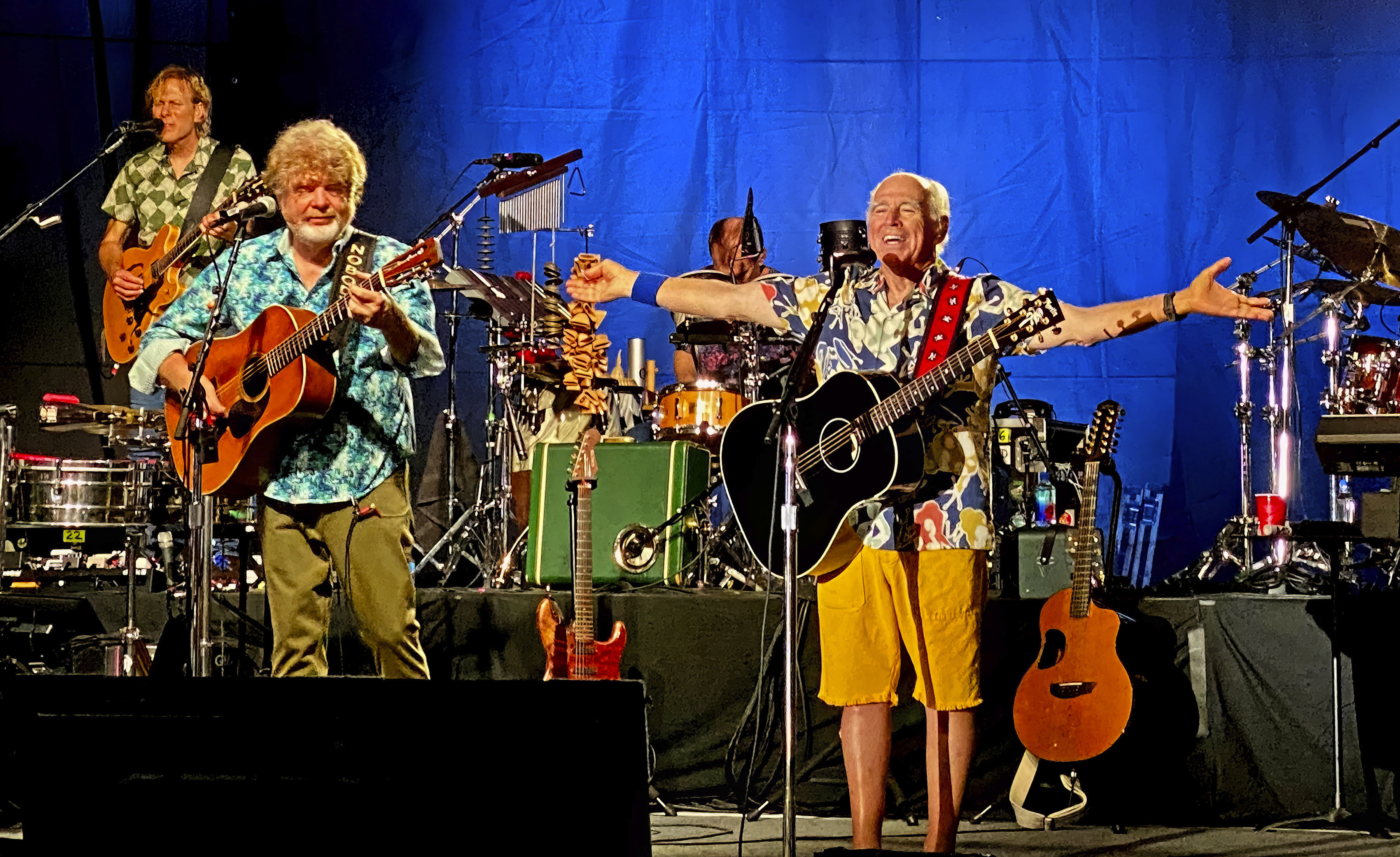 Singer-songwriter Jimmy Buffett, right, along with members of his Coral Reefer Band including Mac McAnally, center, perform during a concert in Key West, Florida  on Thursday, Feb. 9, 2023