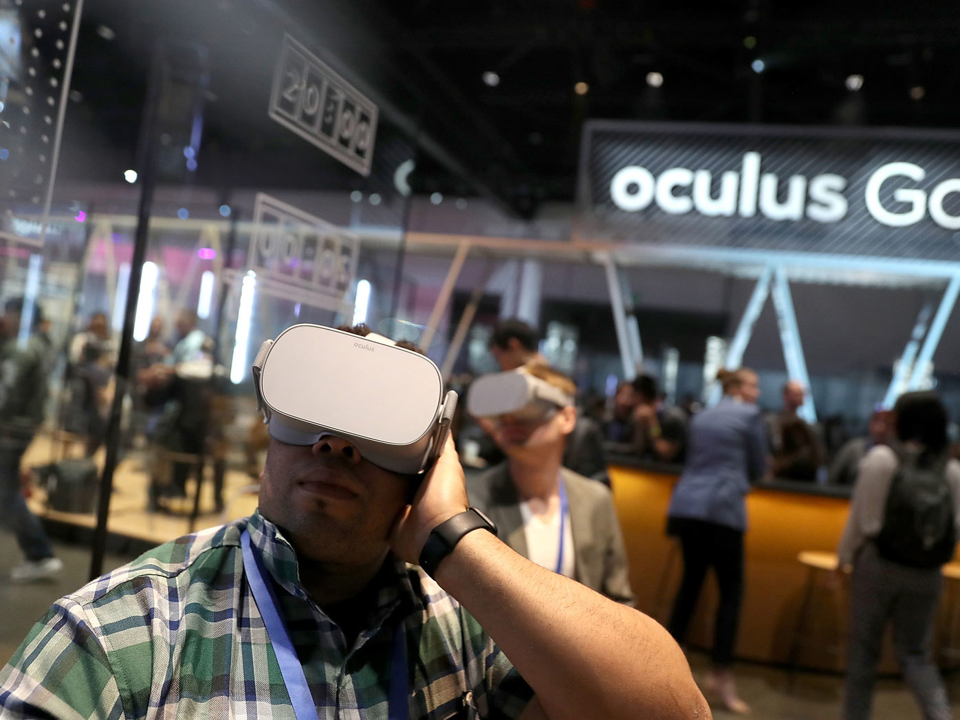 Attendees use the Oculus Go VR headset during the 2018 F8 Facebook Developers conference in San Jose, California.