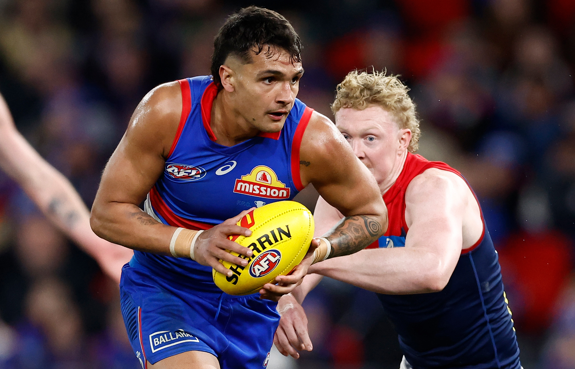 MELBOURNE, AUSTRALIA - AUGUST 02: Jamarra Ugle-Hagan of the Bulldogs and Clayton Oliver of the Demons in action during the 2024 AFL Round 21 match between Footscray and the Melbourne Demons at Marvel Stadium on August 02, 2024 in Melbourne, Australia. (Photo by Michael Willson/AFL Photos via Getty Images)