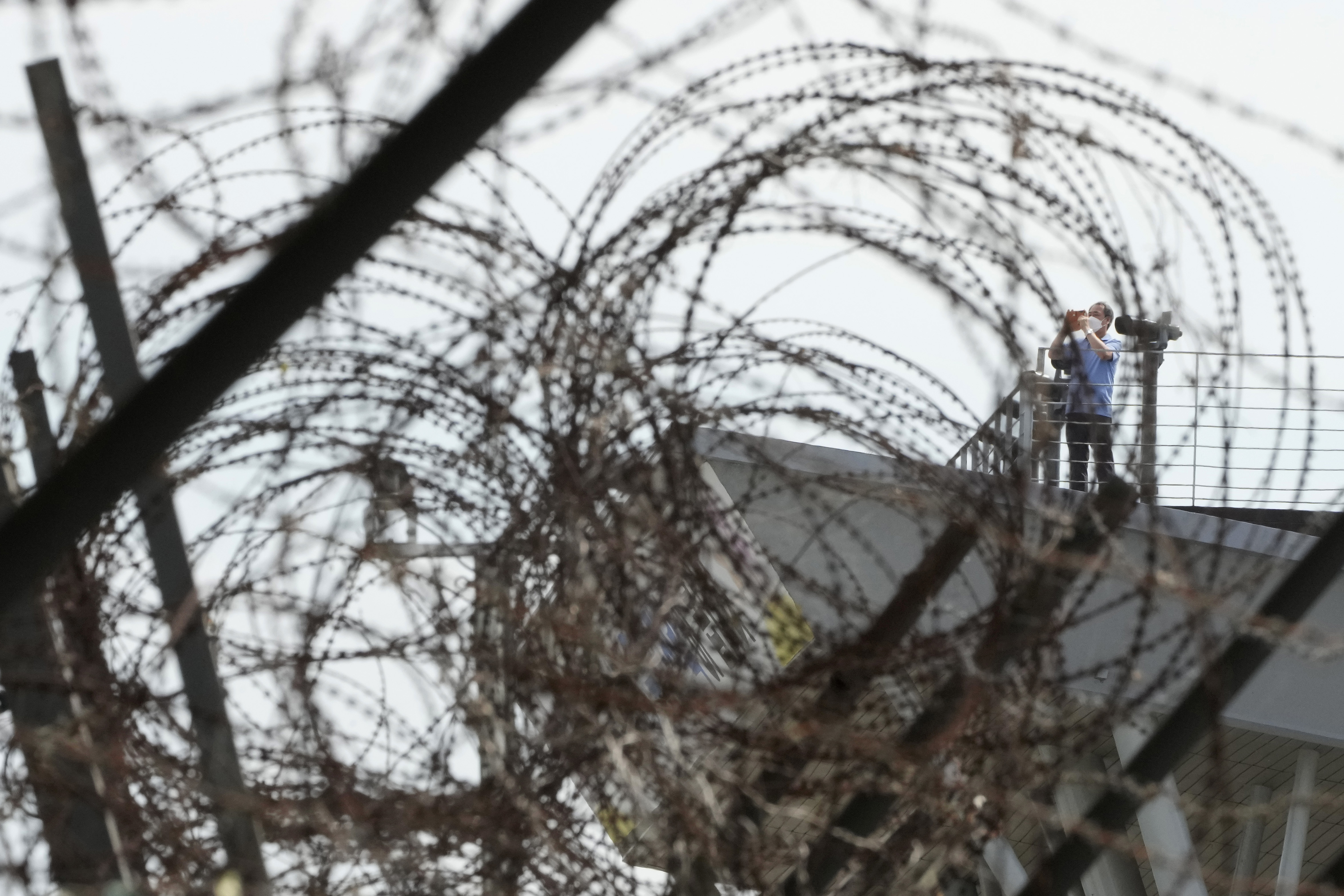 A visitor takes photos toward the North's side at the Imjingak Pavilion in Paju, near the border with North Korea and South Korea.