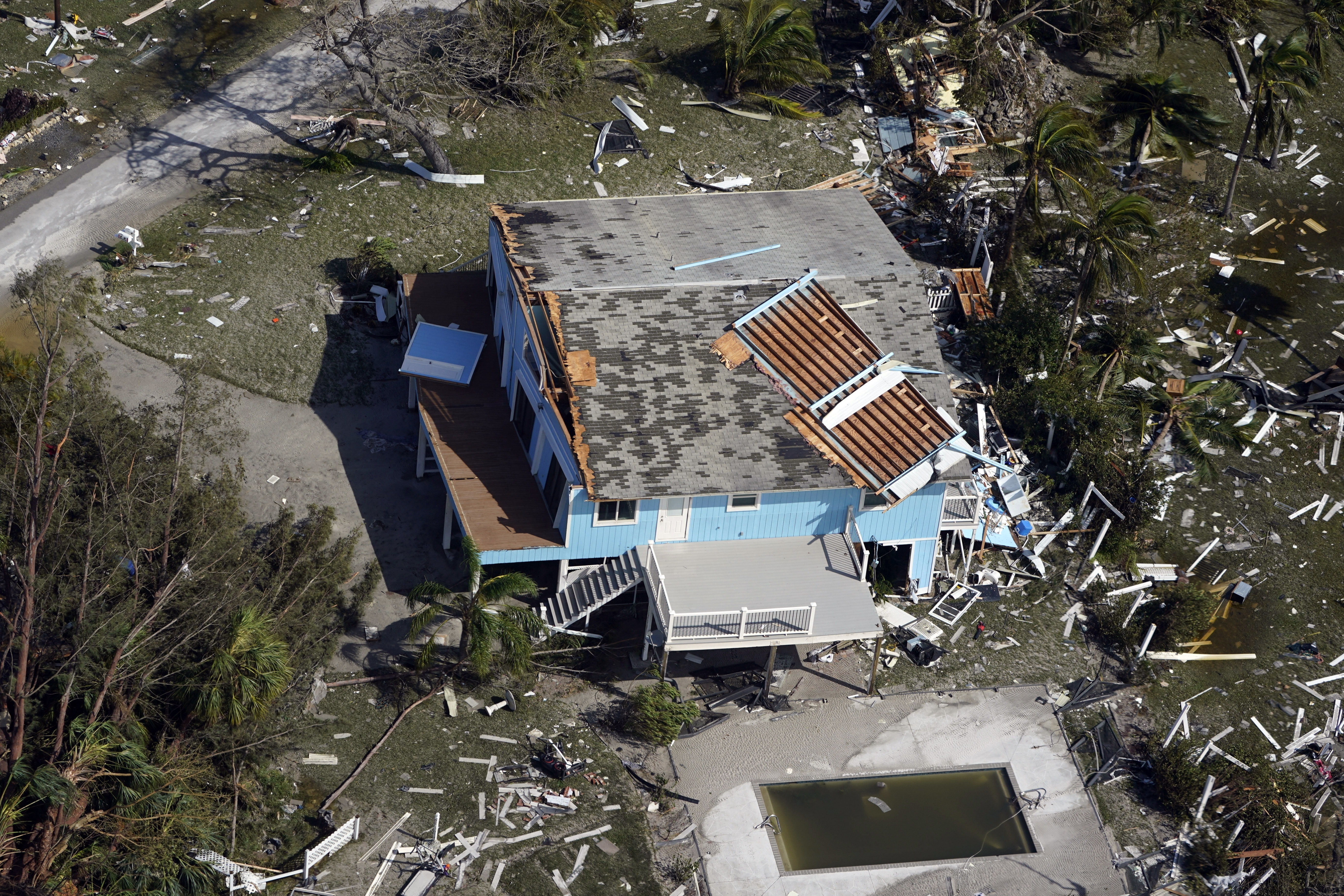 A damaged home and debris is seen in the aftermath of Hurricane Ian, Thursday, Sept. 29, 2022, in Fort Myers Beach, Fla. (AP Photo/Wilfredo Lee)