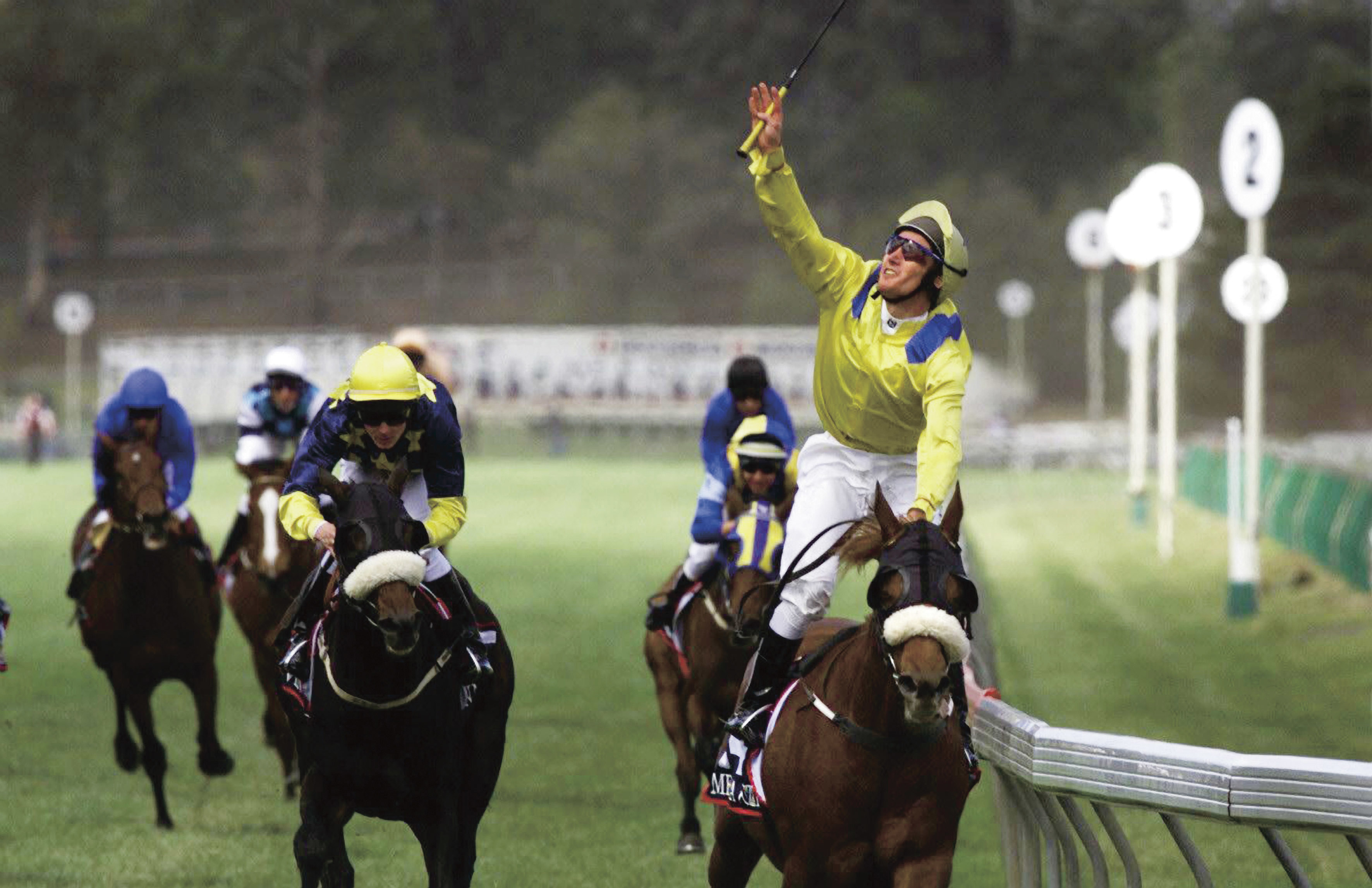 Damien Oliver blows a kiss to his brother Jason as Media Puzzle wins the 2002 Melbourne Cup.