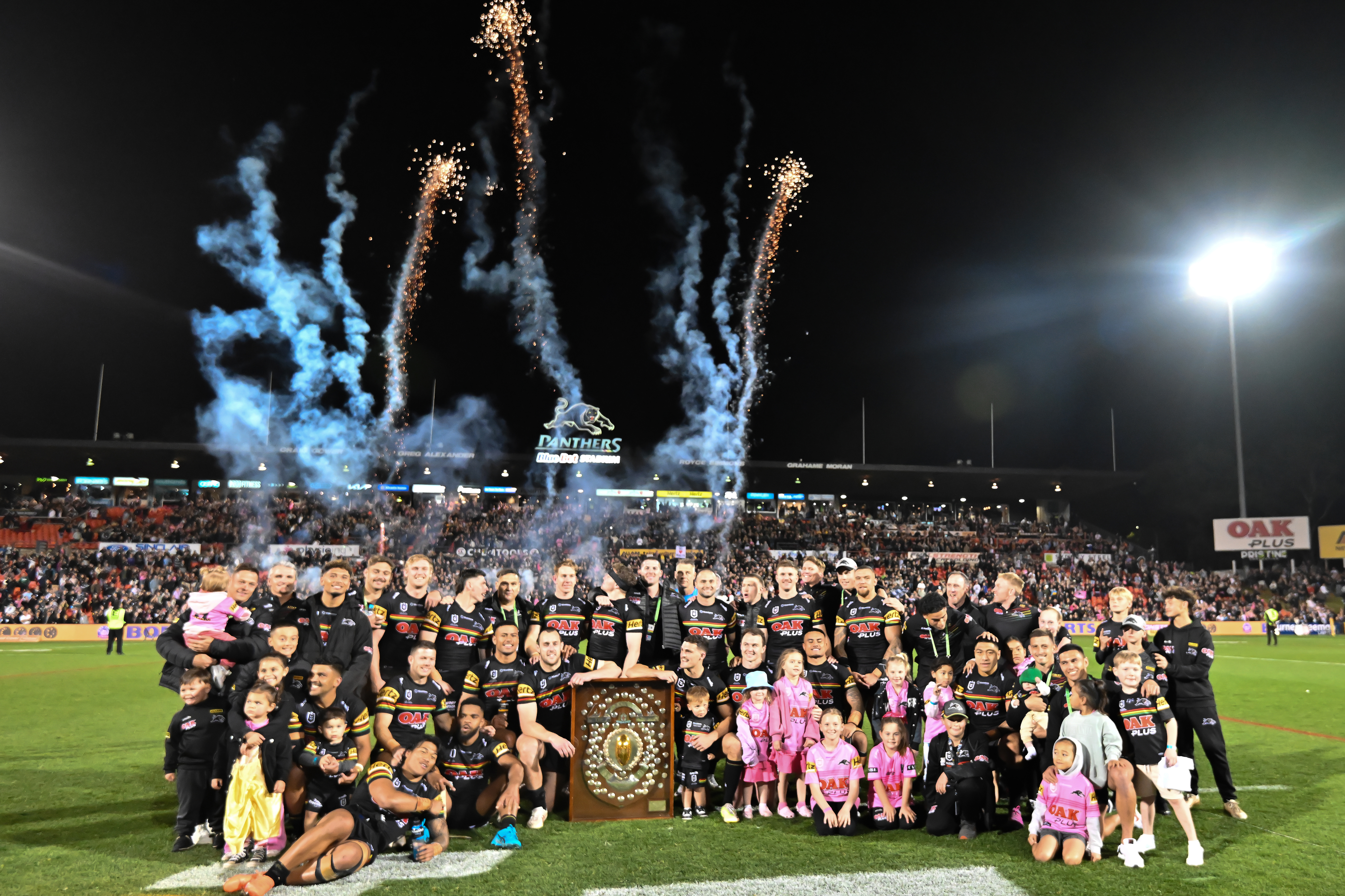 The Penrith Panthers celebrate with the J.J. Giltinan Shield after winning the minor premiership in season 2023.