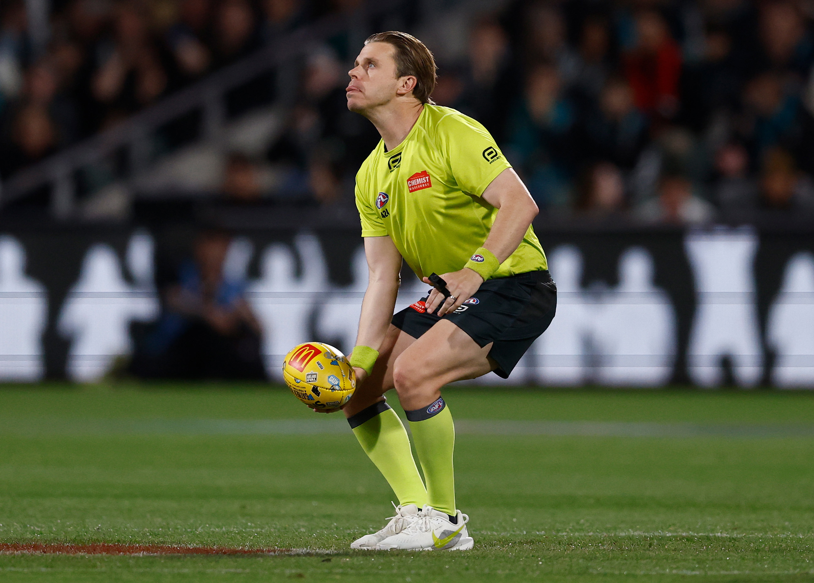 ADELAIDE, AUSTRALIA - APRIL 11: Nick Foot, AFL Field Umpire throws the ball in the air during the 2026 AFL Round 05 match between the Port Adelaide Power and the St Kilda Saints at Adelaide Oval on April 11, 2026 in Adelaide, Australia. (Photo by Michael Willson/AFL Photos via Getty Images)
