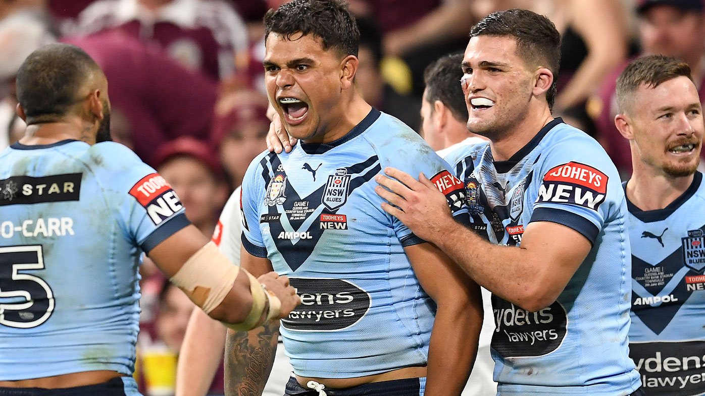  Latrell Mitchell of the Blues celebrates with team mates after scoring a try during game one of the 2021 State of Origin series between the New South Wales Blues and the Queensland Maroons at Queensland Country Bank Stadium on June 09, 2021 in Townsville, Australia. (Photo by Ian Hitchcock/Getty Images)