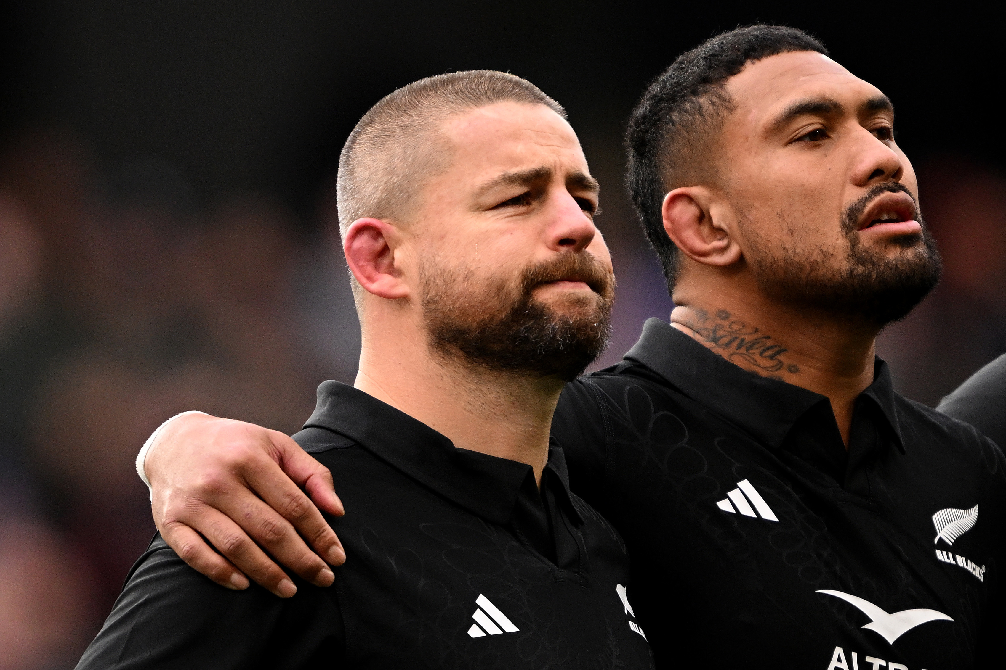 Dane Coles and Ardie Savea of New Zealand stand for the national anthems.