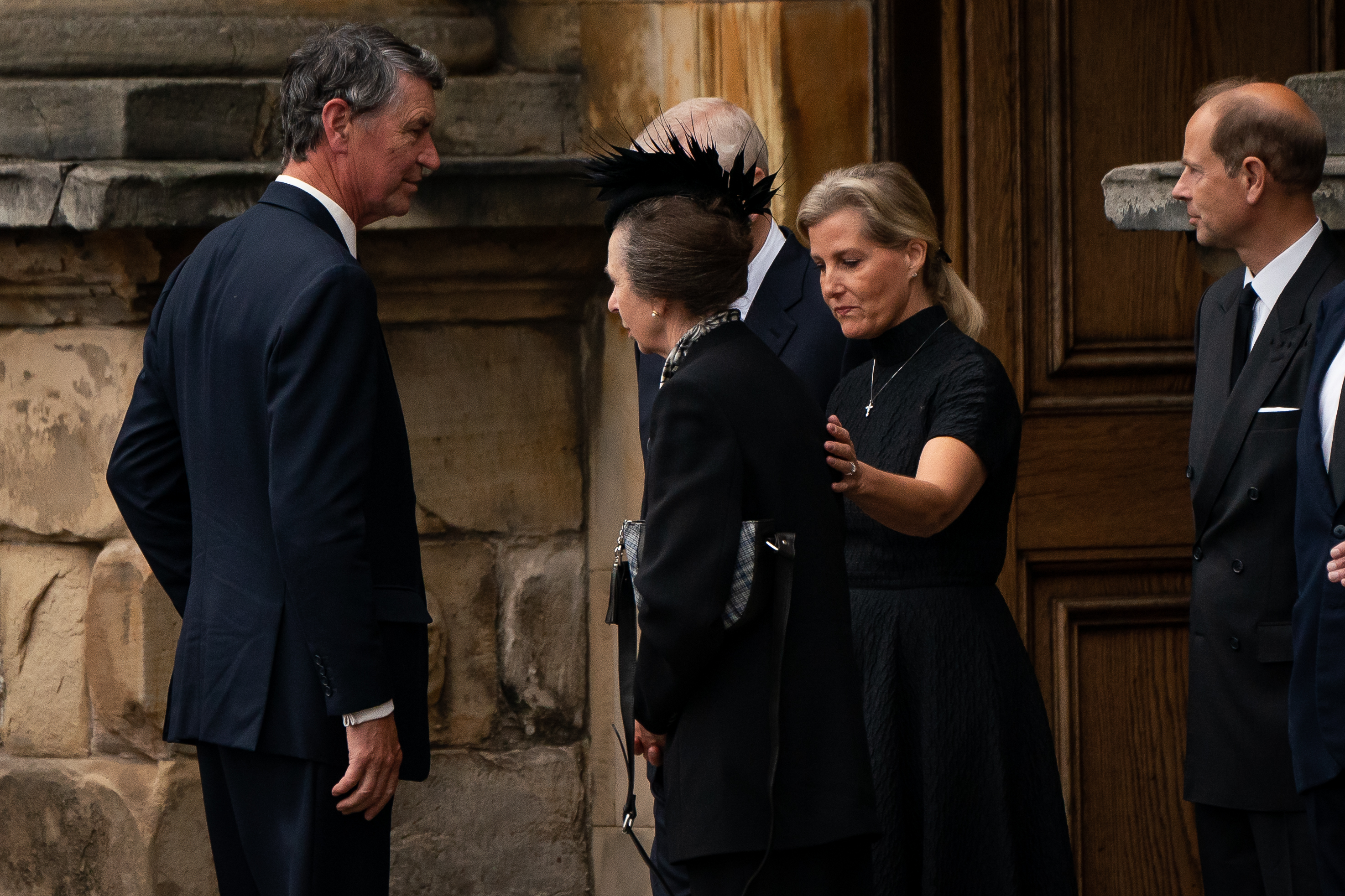 EDINBURGH, SCOTLAND - SEPTEMBER 11:  Britain's Princess Anne, Princess Royal is comforted by Sophie, Countess of Wessex as the coffin of Queen Elizabeth II completes its journey from Balmoral to the Palace of Holyroodhouse on September 11, 2022 in Edinburgh, United Kingdom. Elizabeth Alexandra Mary Windsor was born in Bruton Street, Mayfair, London on 21 April 1926. She married Prince Philip in 1947 and ascended the throne of the United Kingdom and Commonwealth on 6 February 1952 after the death