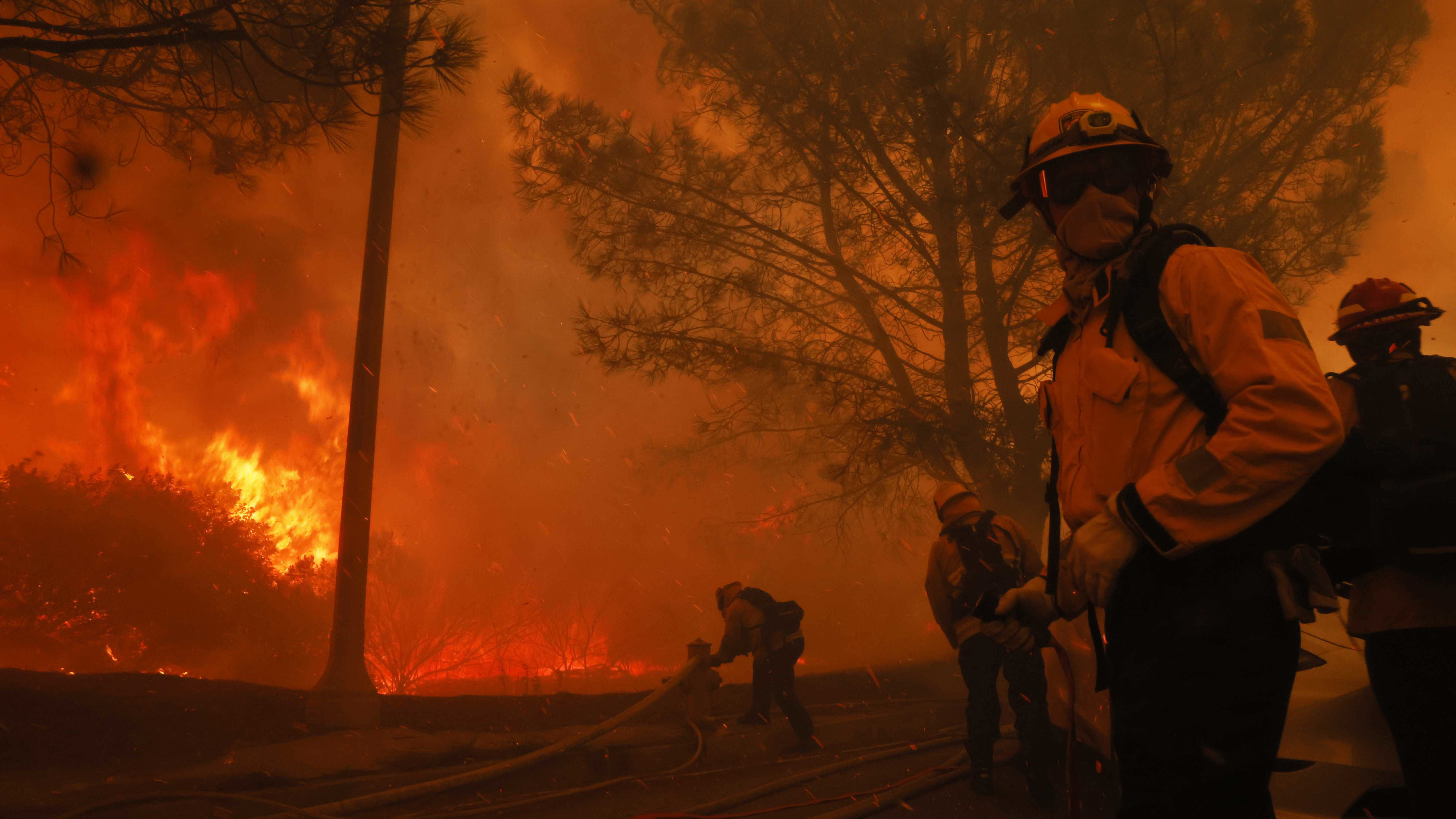 Firefighters battle the advancing Palisades Fire in the Pacific Palisades neighbourhood of Los Angeles.