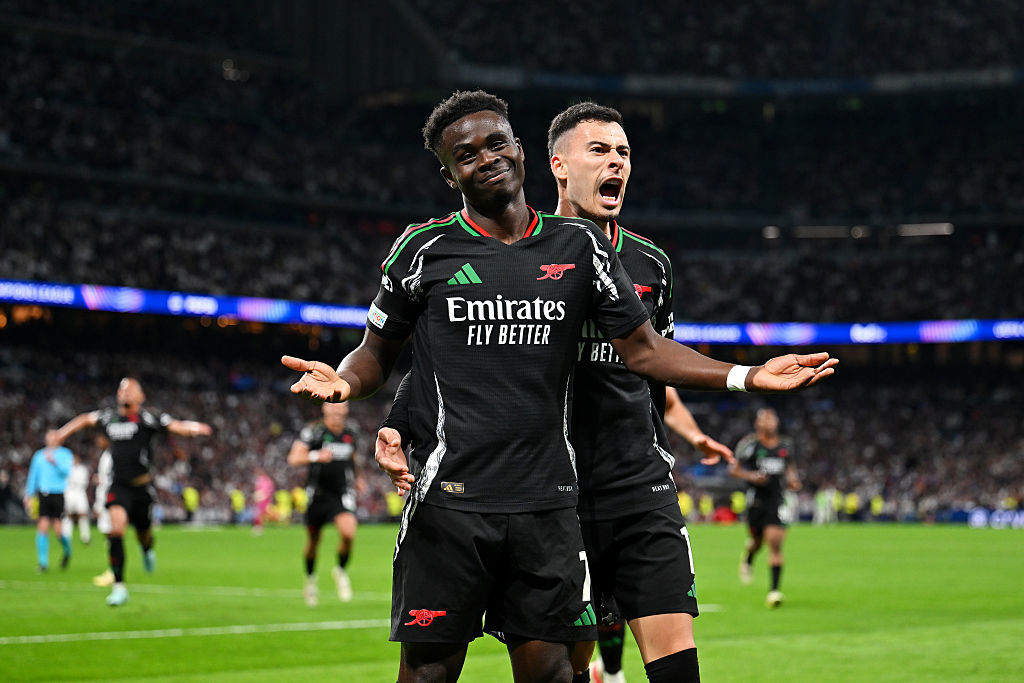 Bukayo Saka of Arsenal celebrates scoring with teammate Gabriel Martinelli.