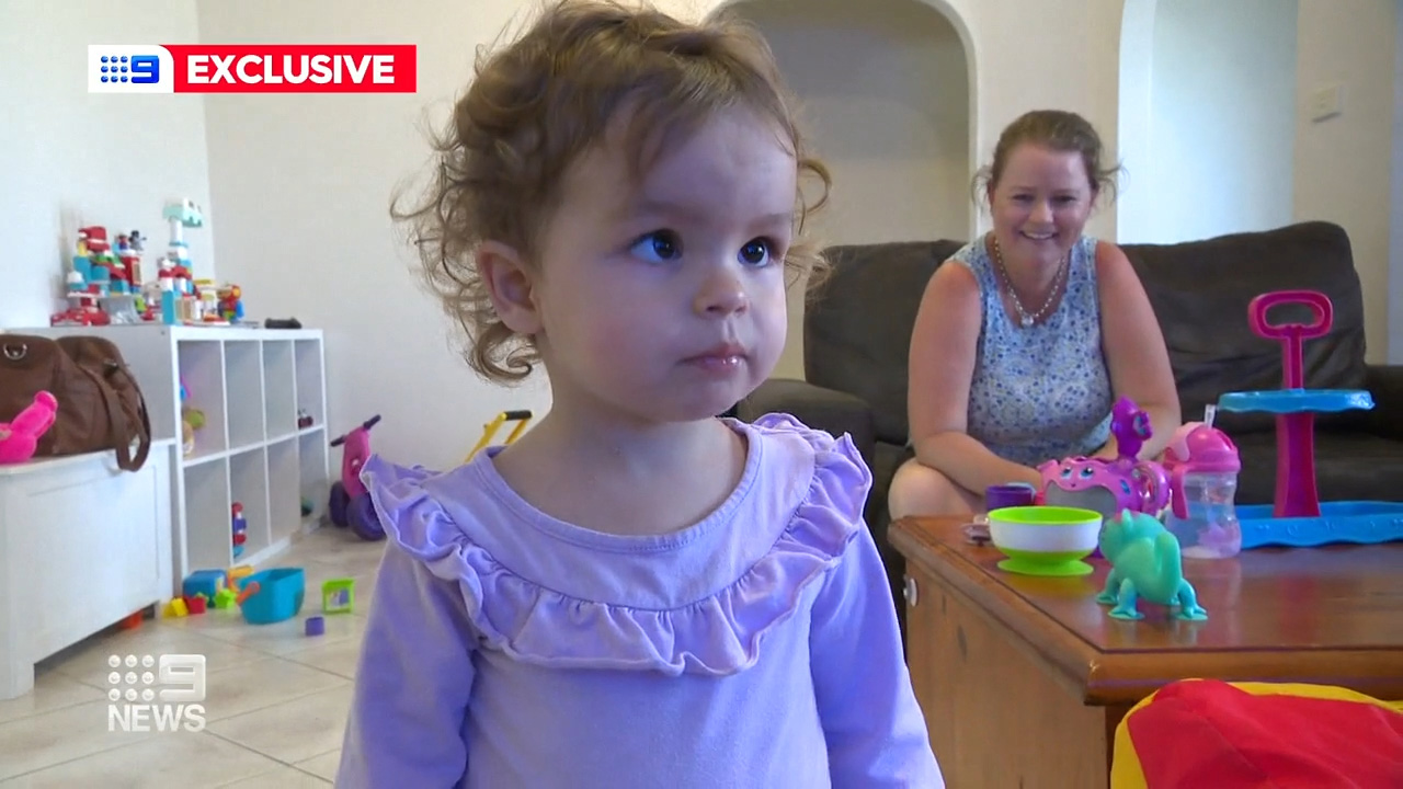 A shortage of anaesthetists at a Sydney hospital has been experienced by one mother who says her daughter's deadly condition was almost dismissed.The state government has promised it is working on a solution.
Charlotte Rothe, two, has a rare birth defect, the severity of which almost went undiagnosed.