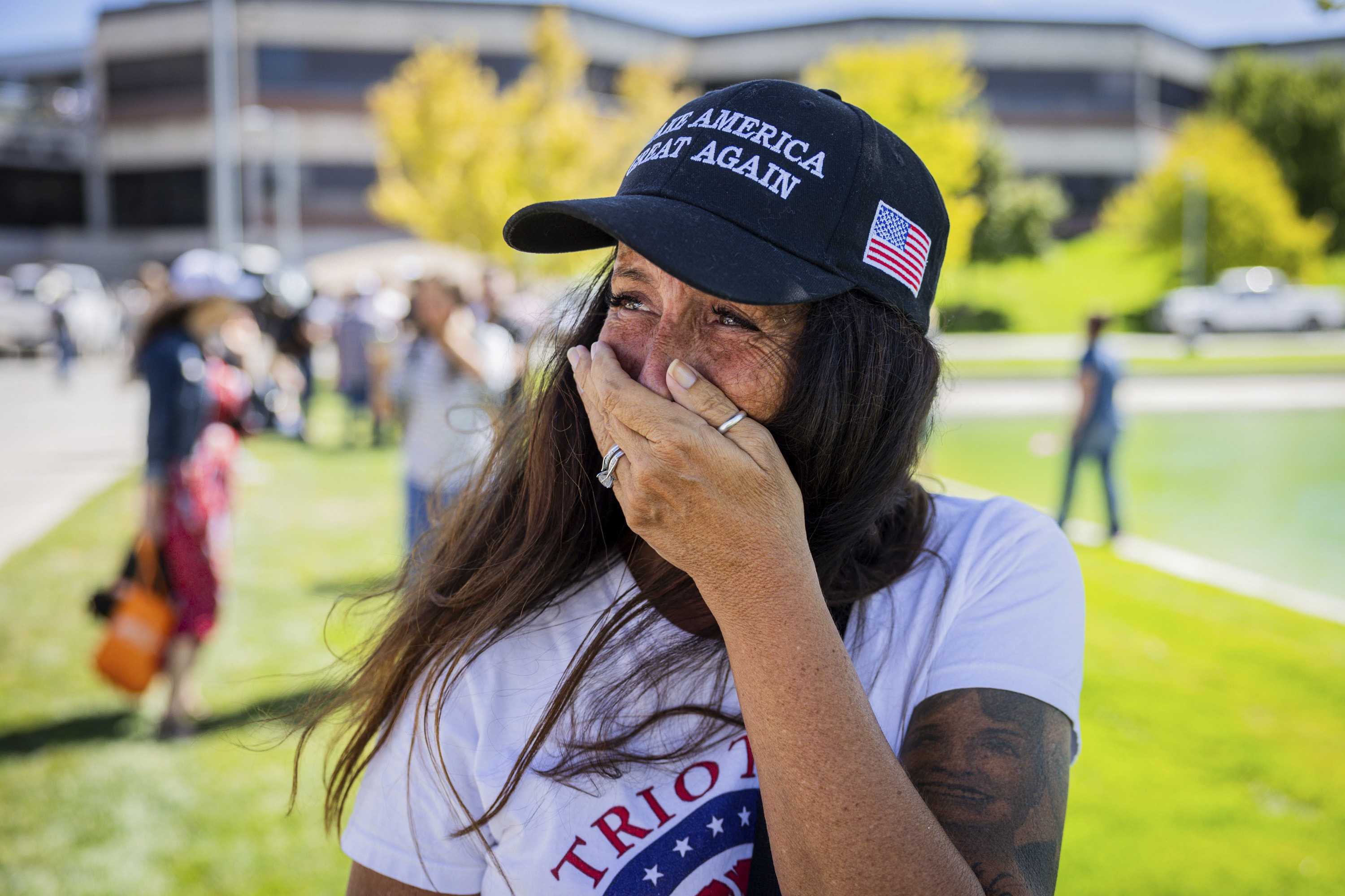 Allison Hemingway-Witty cries after Charlie Kirk is shot during Turning Point's visit to Utah Valley University in Orem, Utah, Wednesday, Sept. 10, 2025. (Tess Crowley/The Deseret News via AP)