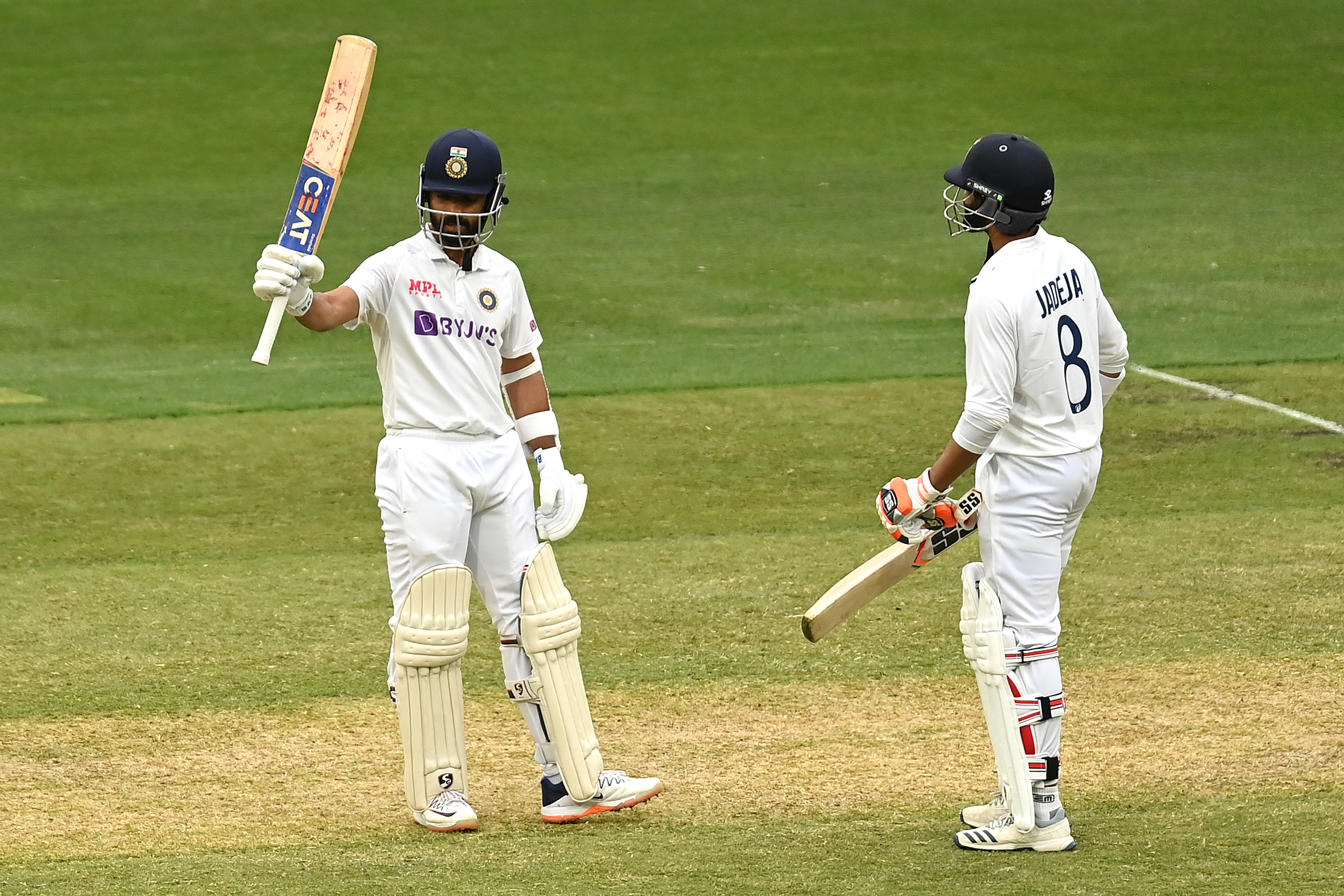 Ajinkya Rahane of India celebrates making 50.