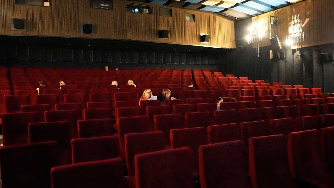 The audience waits for Melania to begin at a screening in her home country of Slovenia.