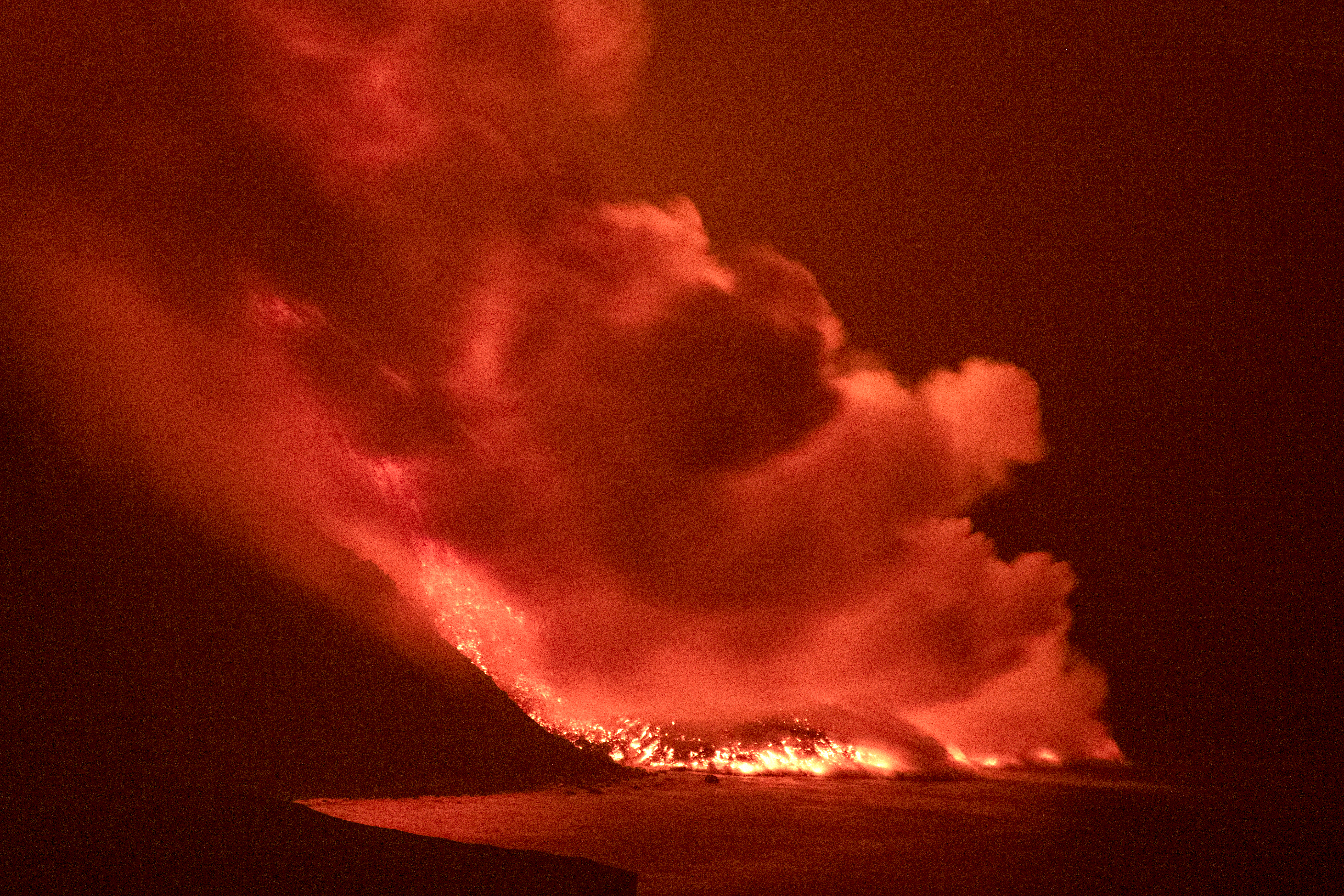 Lava from a volcano reaches the sea on the Canary island of La Palma, Spain. 