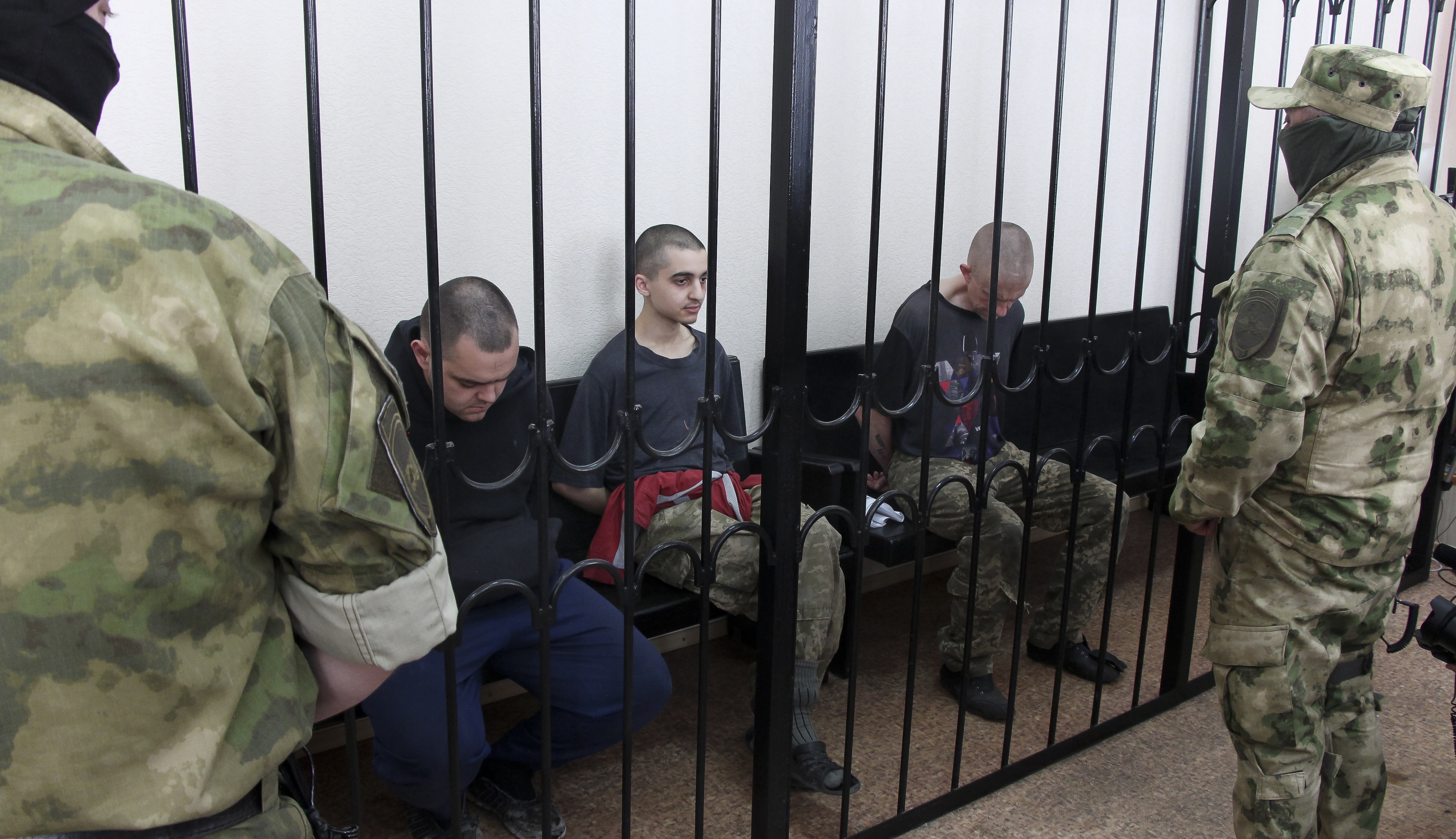 Two British citizens Aiden Aslin, left, and Shaun Pinner, right, and Moroccan Saaudun Brahim, center, have been sentenced to death by pro-Moscow rebels in eastern Ukraine for fighting on Ukraine's side. 