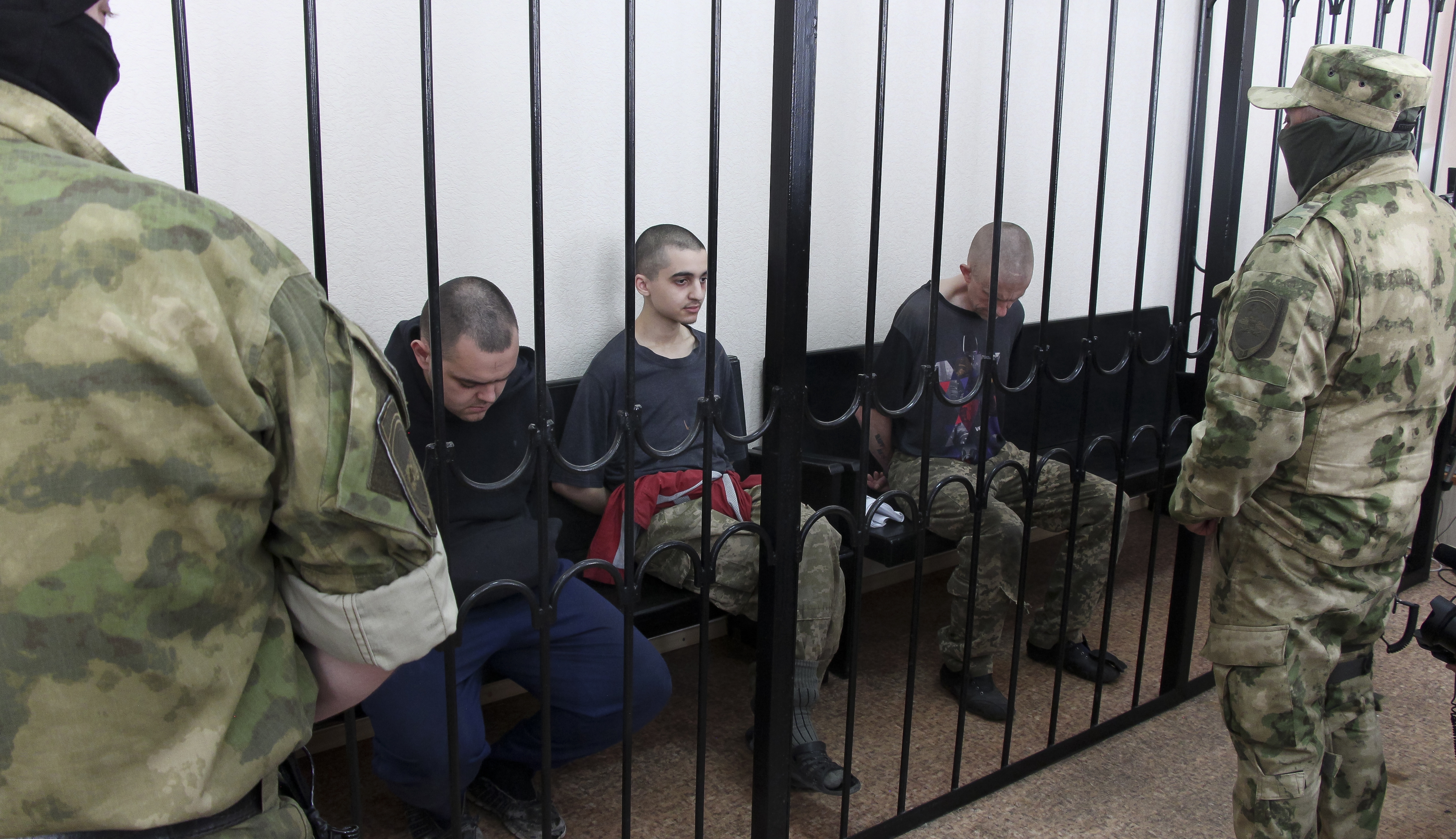 Two British citizens Aiden Aslin, left, and Shaun Pinner, right, and Moroccan Saaudun Brahim, center, have been sentenced to death by pro-Moscow rebels in eastern Ukraine for fighting on Ukraine's side.