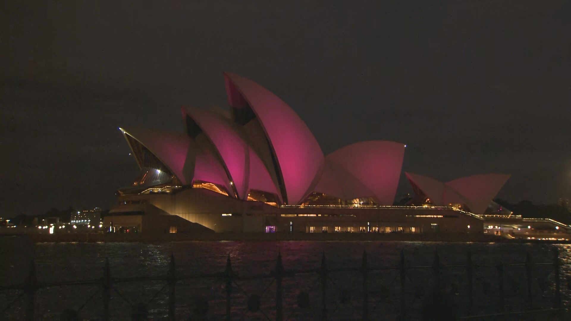 Sydney Opera House sails glow pink in honour of Olivia Newton-John.