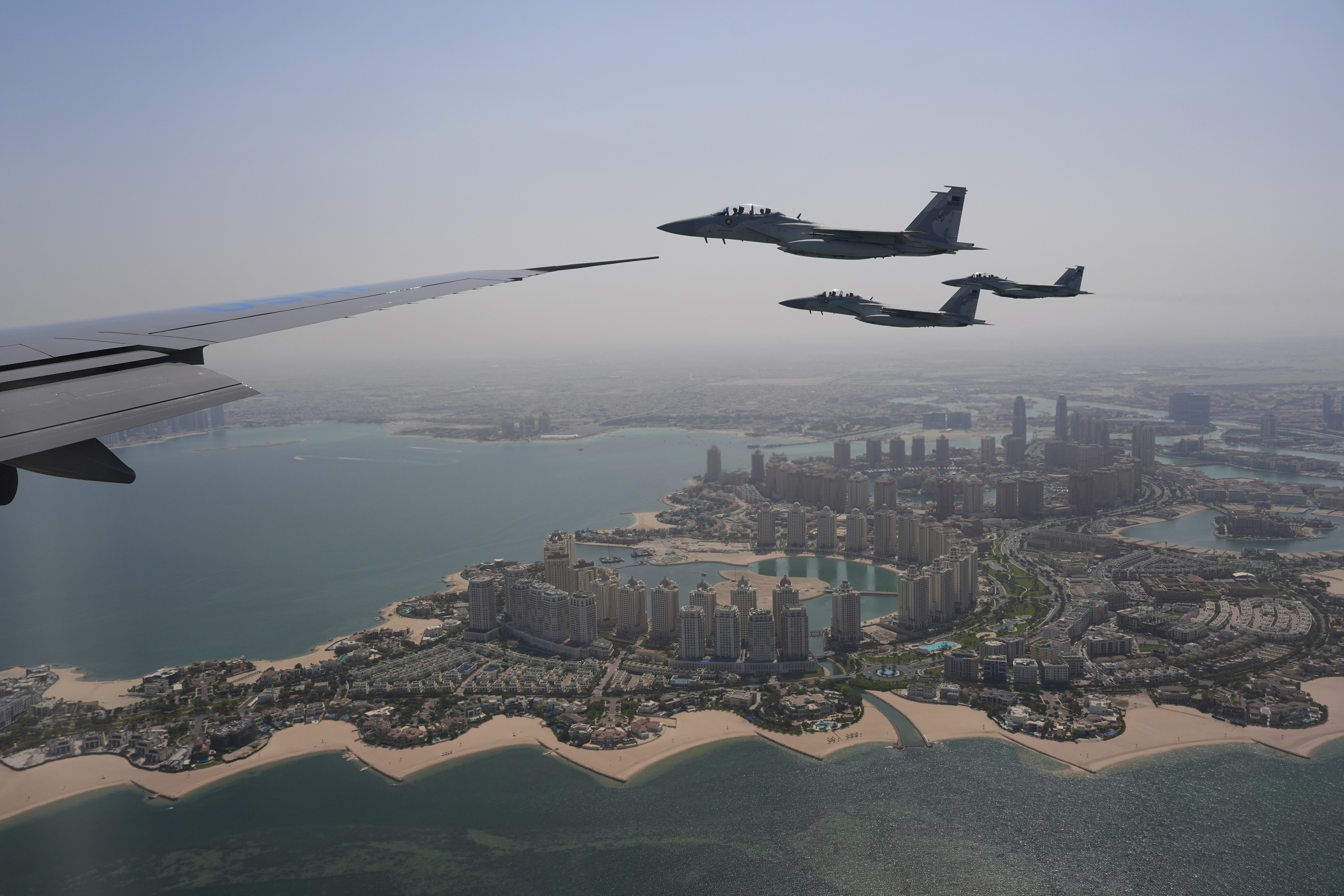 Qatar Emiri Air Force F-15s provide an honorary escort for Air Force One
