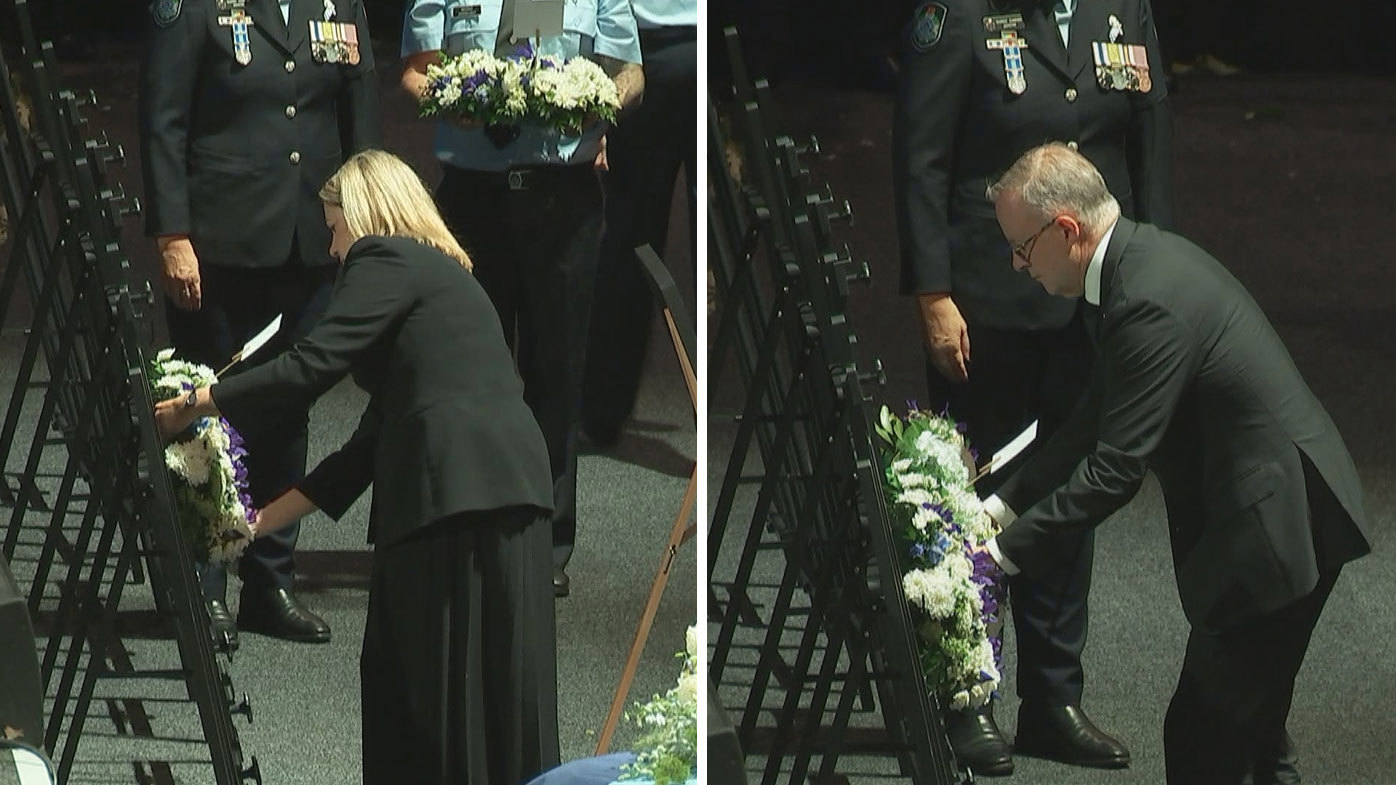 Premier Annastacia Palaszczuk and Prime Minister Anthony Albanese lay wreathes at the memorial for the slain police officers.