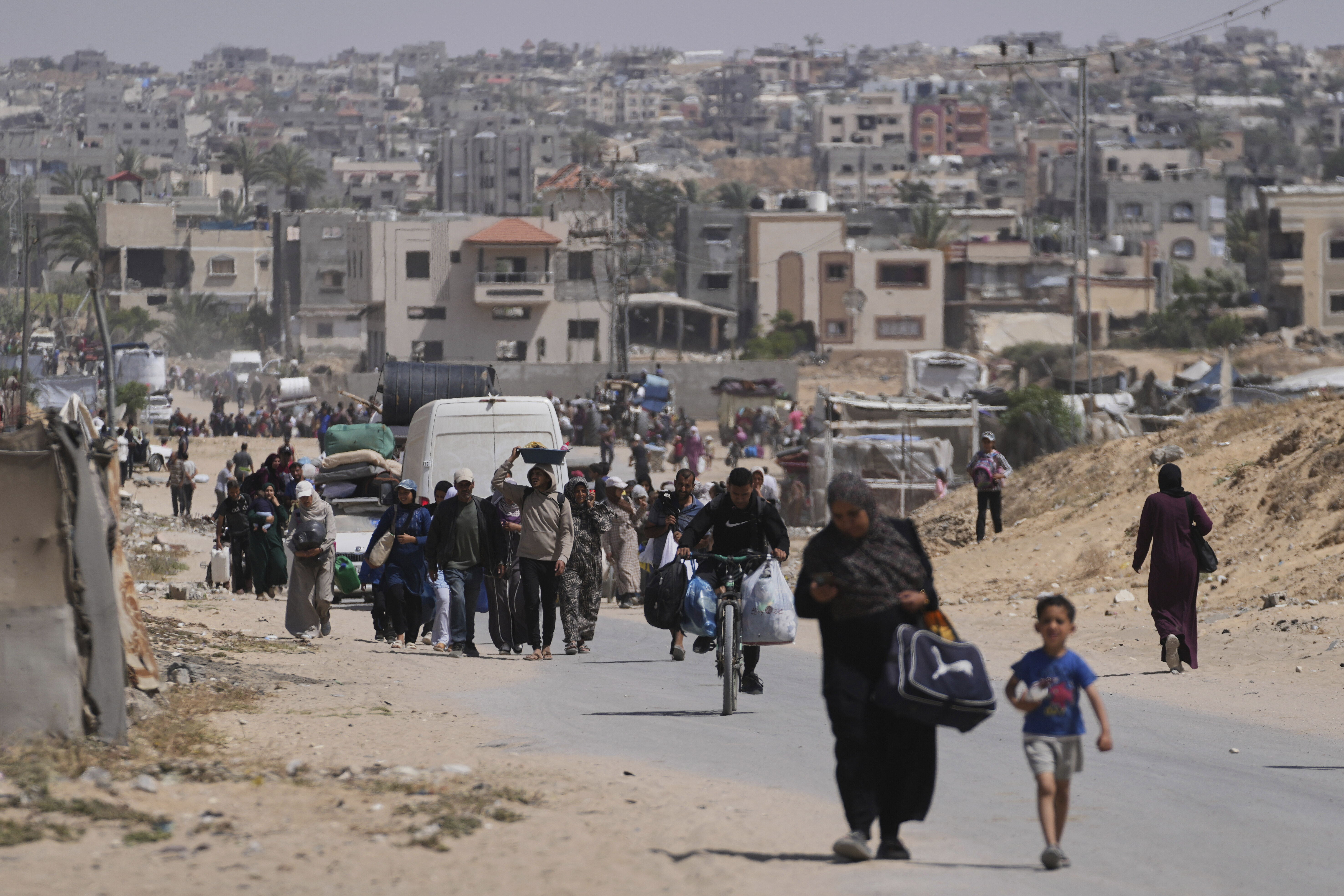 Displaced Palestinians flee from Khan Younis, Gaza, amid the ongoing Israeli military offensive in the area, on Monday, May 19, 2025. (AP Photo/Abdel Kareem Hana)