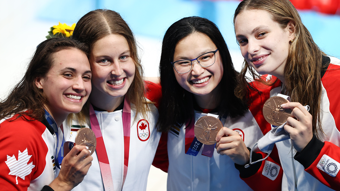 Bronze medalist Kylie Masse, Sydney Pickrem, Margaret Macneil and Penny Oleksiak of Team Canada pose after the medal ceremony for the Women's 4 x 100m Medley Relay Final