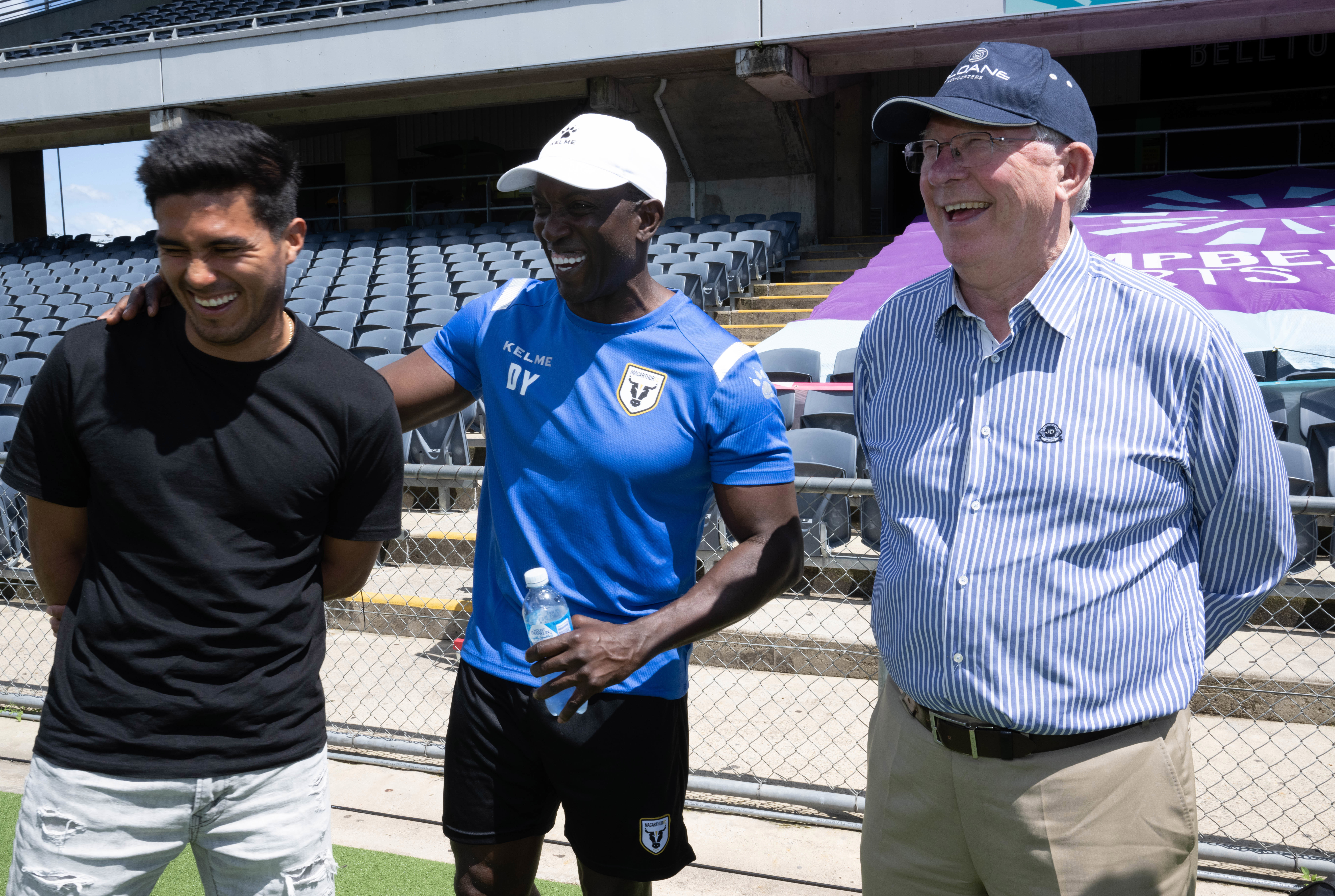 Sir Alex Ferguson (right) with Macarthur FC Dwight Yorke (centre) and captain Ulises Davila.