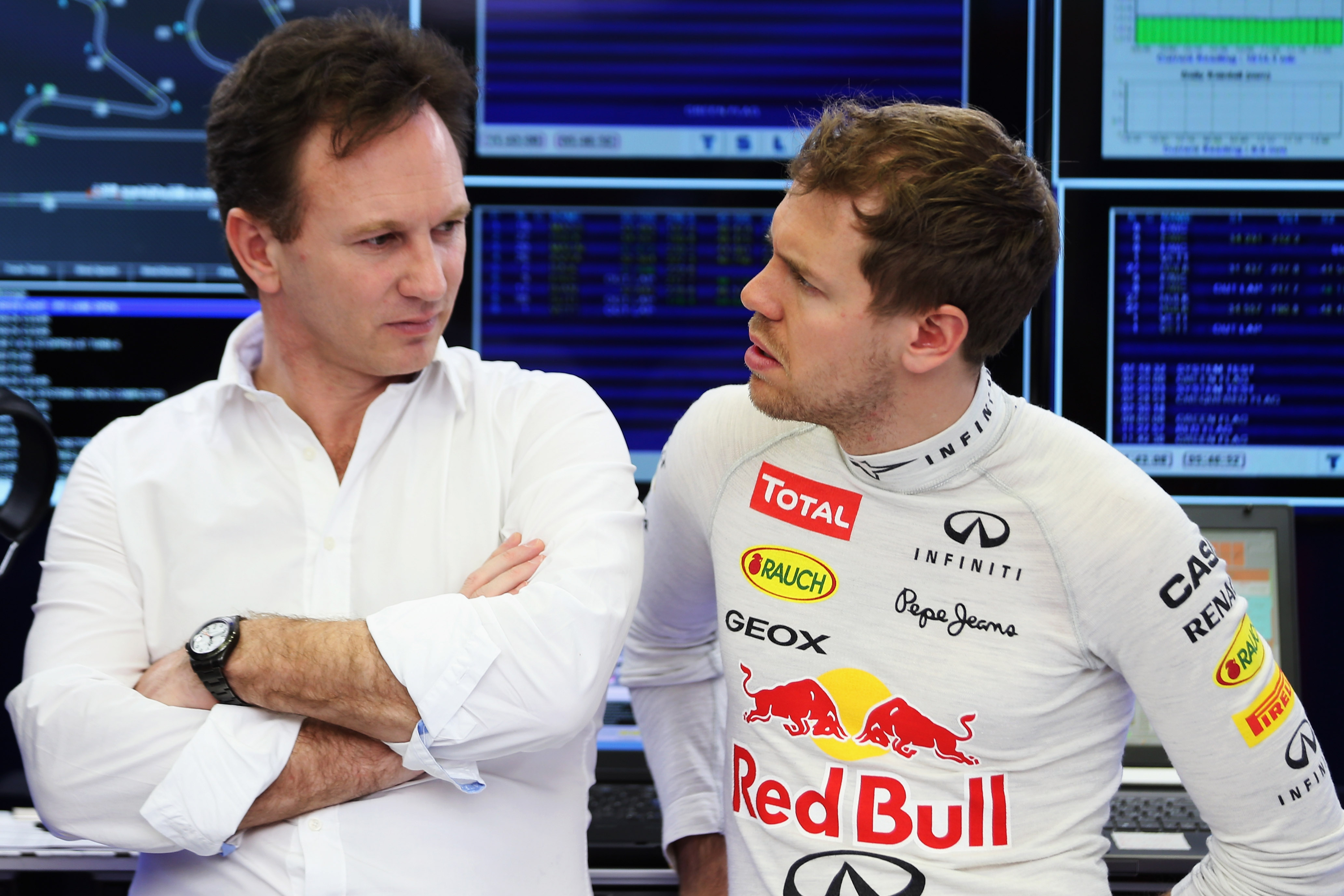 Christian Horner and Sebastian Vettel during day three of Formula One Winter Testing at the Bahrain International Circuit on March 1, 2014 in Bahrain, Bahrain.