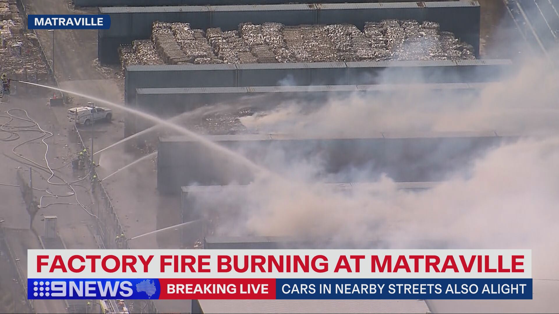 The six alarm fire has tore through a paper storage facility in Sydney's east.