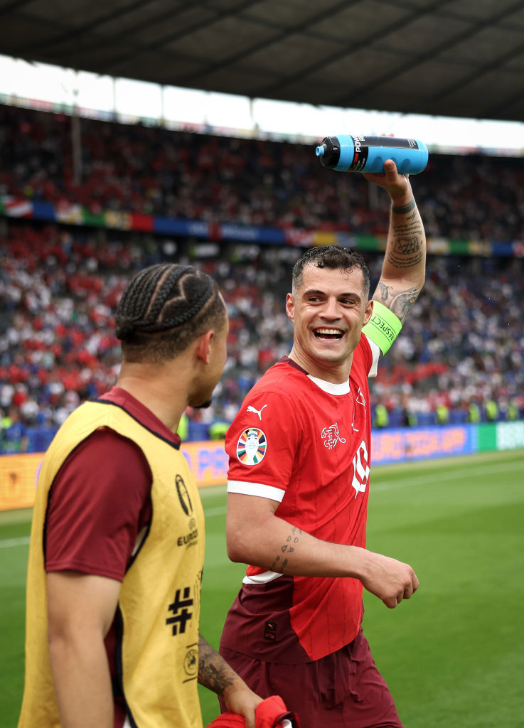 Granit Xhaka of Switzerland celebrates during the UEFA EURO 2024 round of 16 match between Switzerland and Italy.