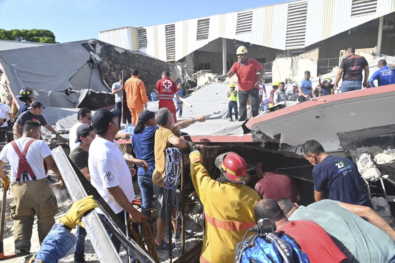 Rescue workers search for survivors amid debris after the roof of a church collapsed