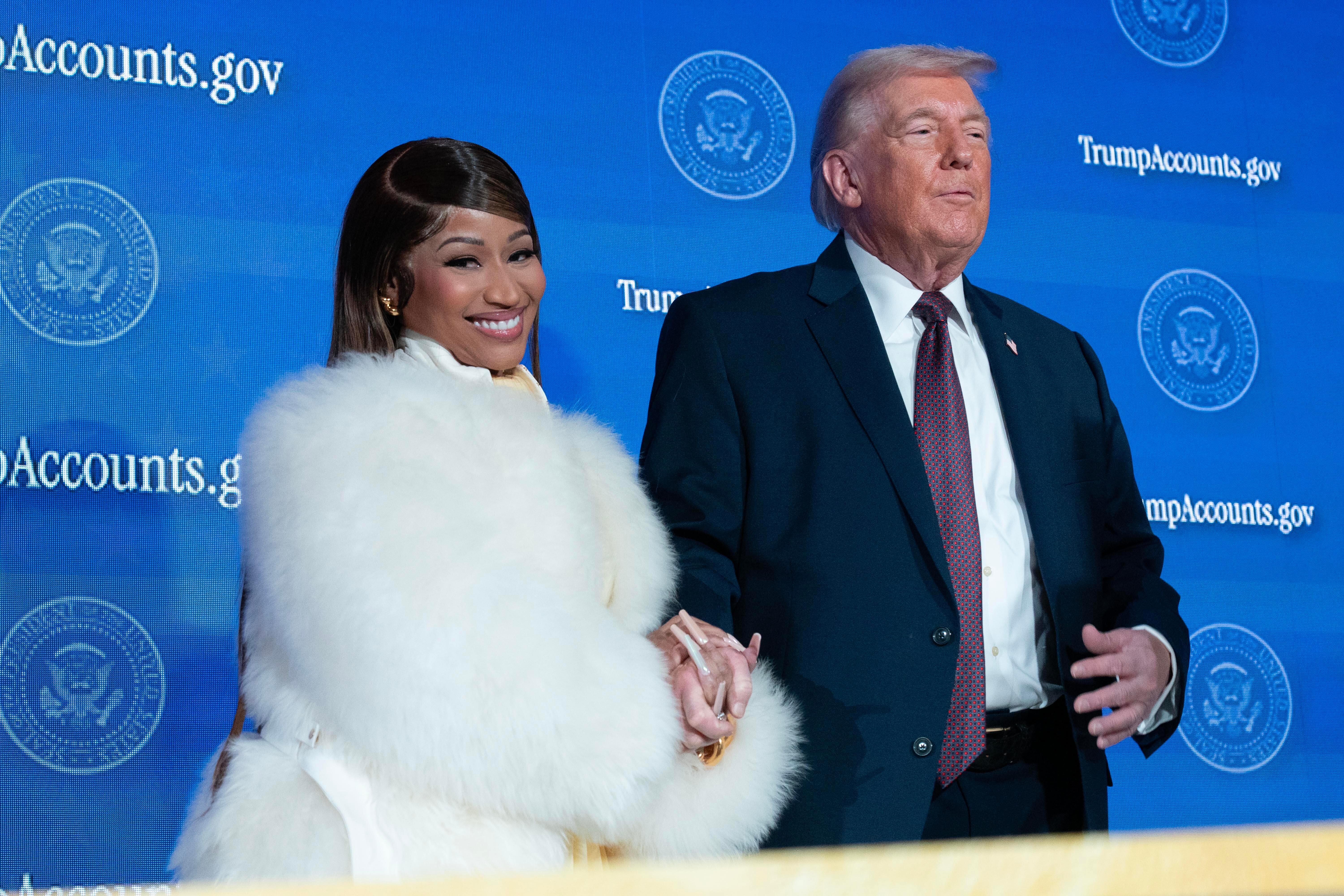 President Donald Trump greets Nicki Minaj during the event "Trump Accounts" at the Andrew W. Mellon Auditorium, Wednesday, Jan. 28, 2026, in Washington. 