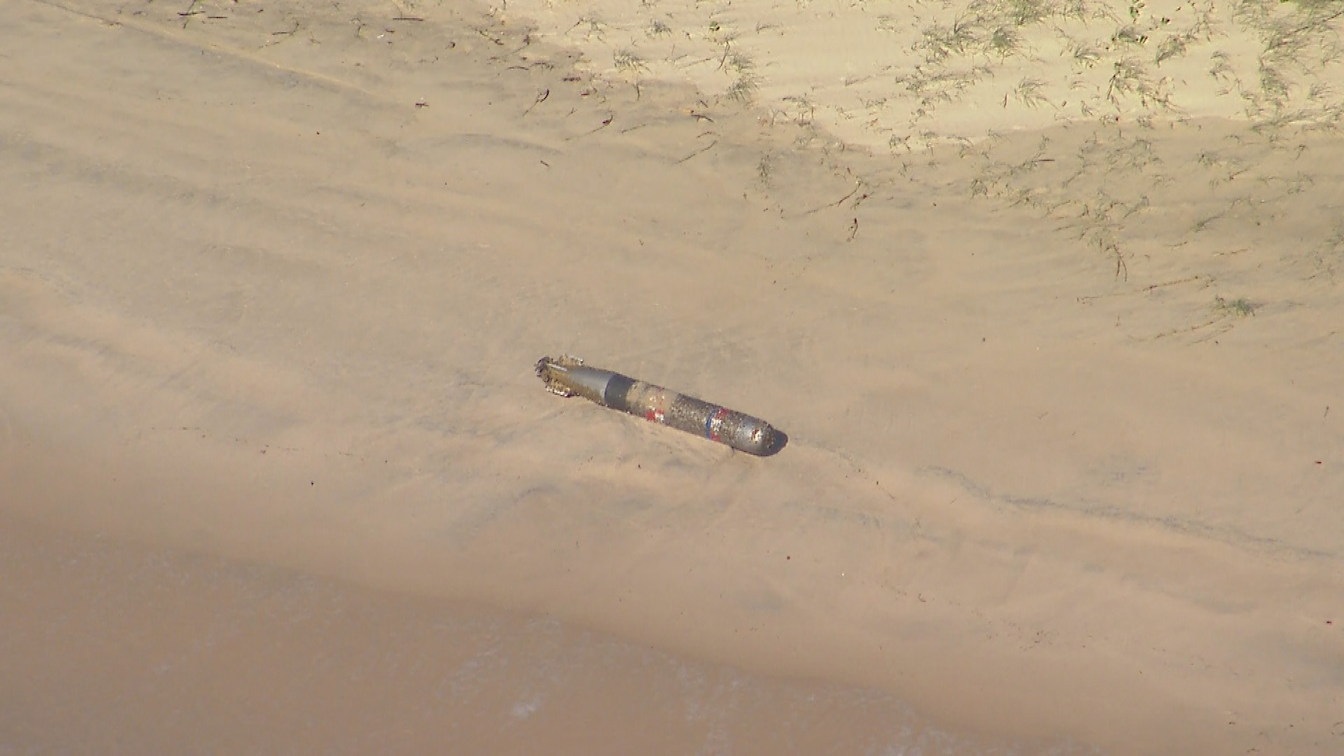 Suspected torpedo washes up on Gold Coast beach