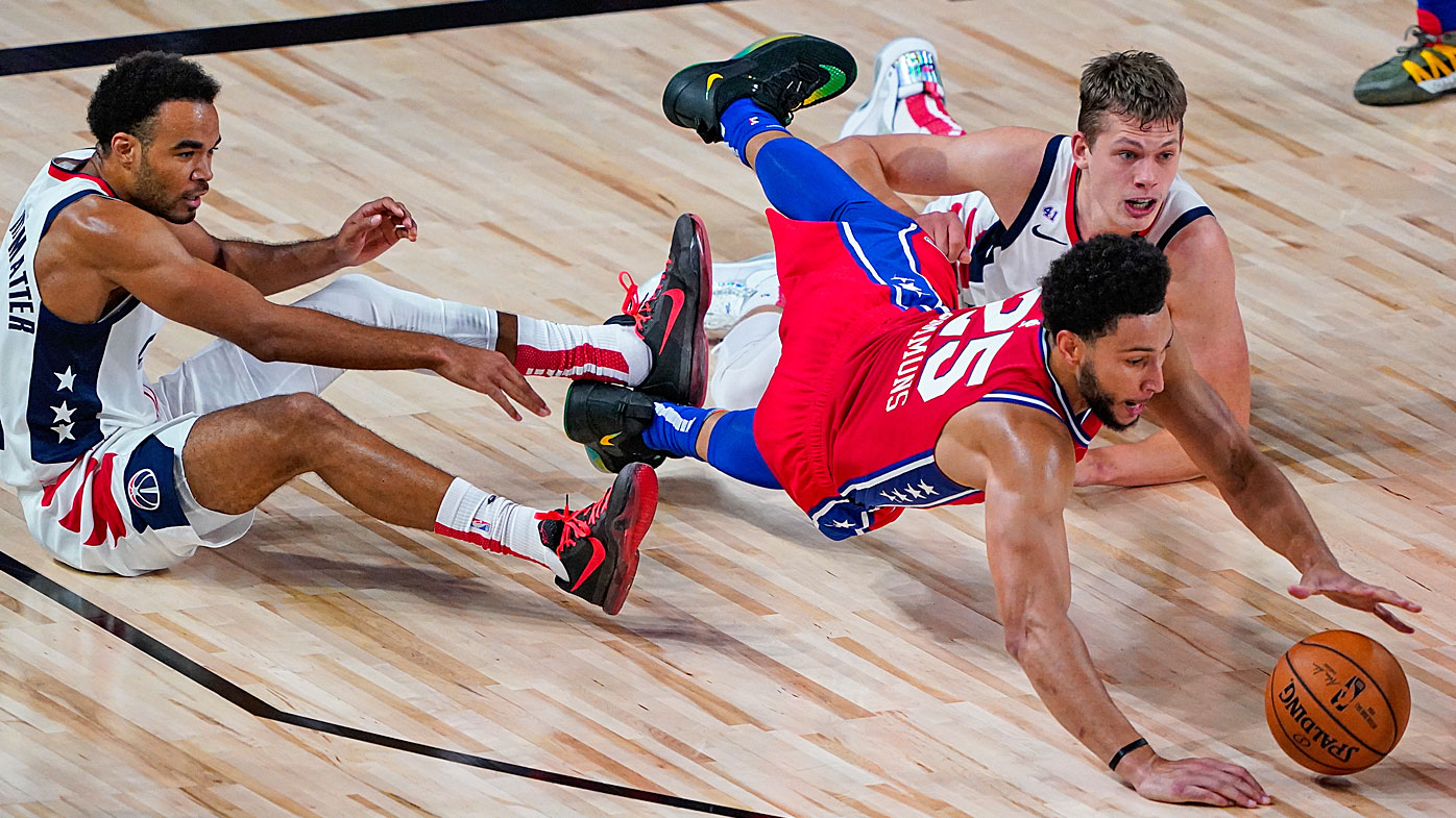 Ben Simmons #25 of the Philadelphia 76ers goes for a loose ball 