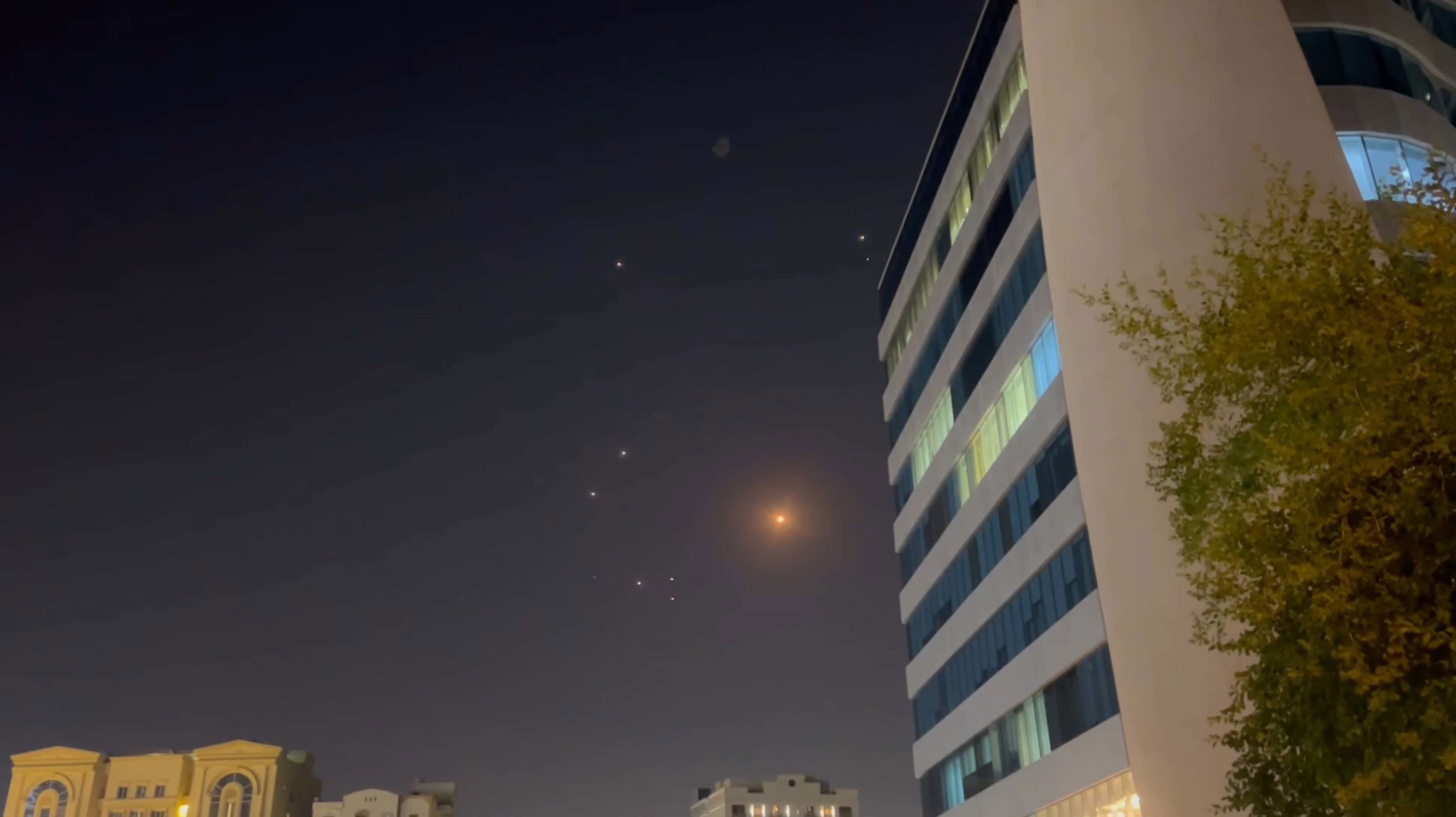 In this frame-grab made from video, missiles and air-defence interceptors illuminate the night sky over Doha after Iran launched an attack on US forces at Al Udeid Air Base on June 23, 2025 in Doha.